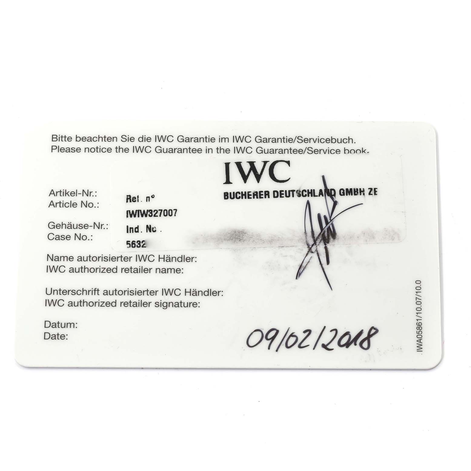 The image shows an IWC guarantee card for the Pilot model, including article number, case number, retailer signature, and date.