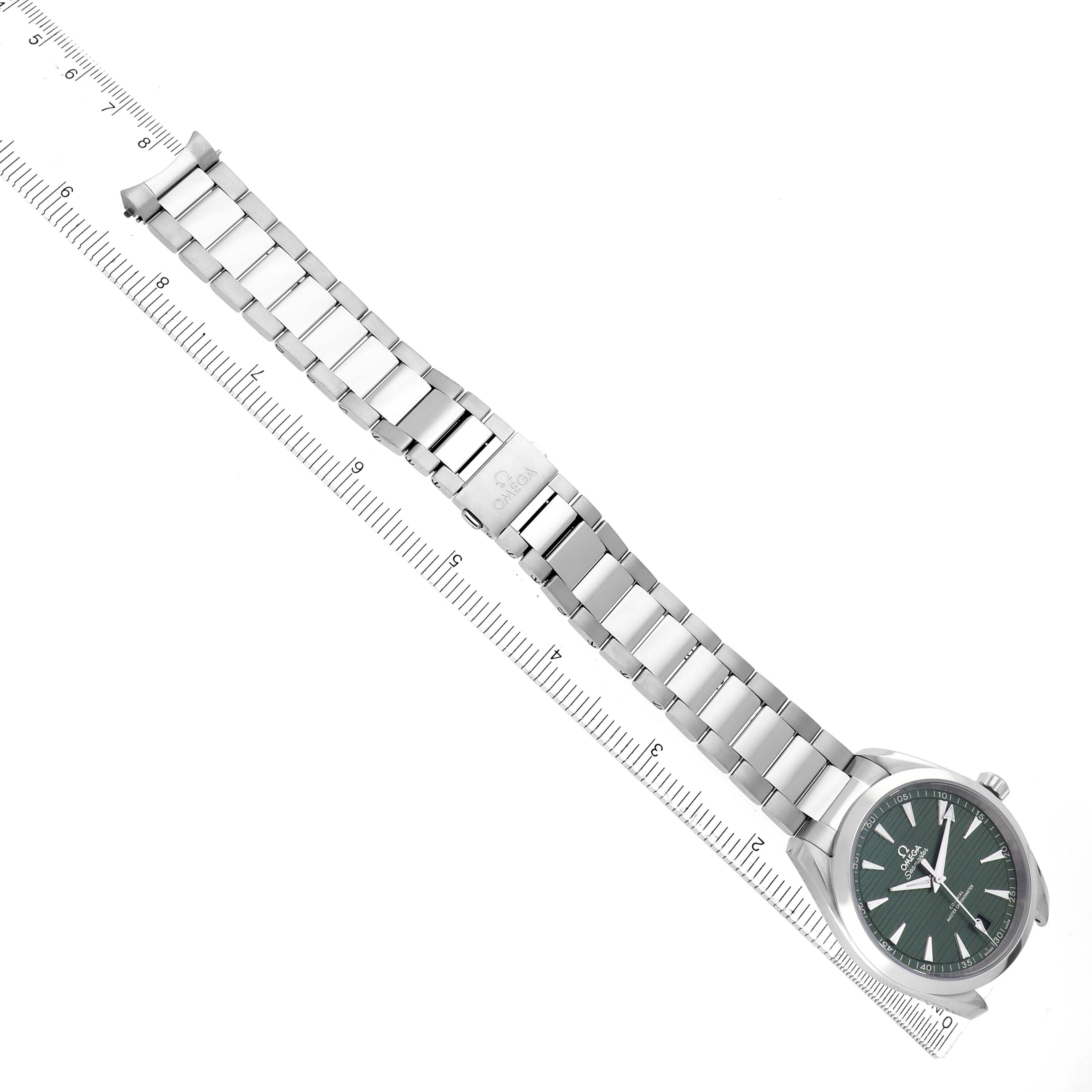 The Omega Aqua Terra 220.10.41.21.10.001 Men
s Stainless Steel Green Dial watch is shown from a top-down angle, displaying the full bracelet and clasp alongside a ruler for scale.