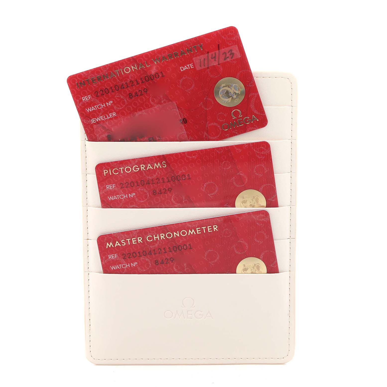 The image shows three red cards in a white holder for the Omega Aqua Terra 220.10.41.21.10.001 Men
s Stainless Steel Green Dial, featuring warranty and certification.