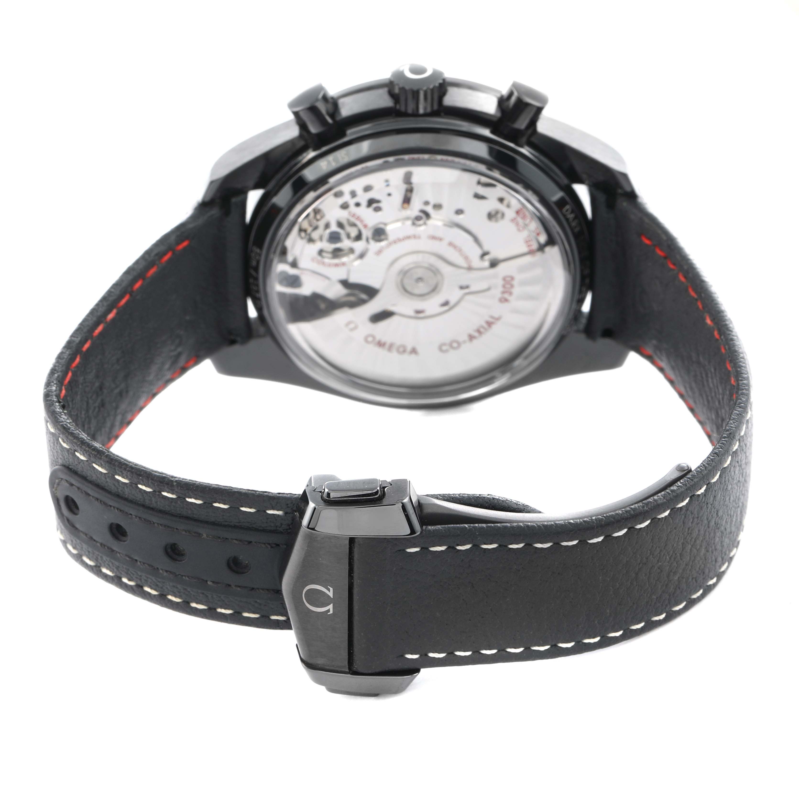 The image shows the back view of an Omega Speedmaster O311.92.44.51.01.003 Men
s Ceramic Black Dial, highlighting the movement and leather strap with white stitching.