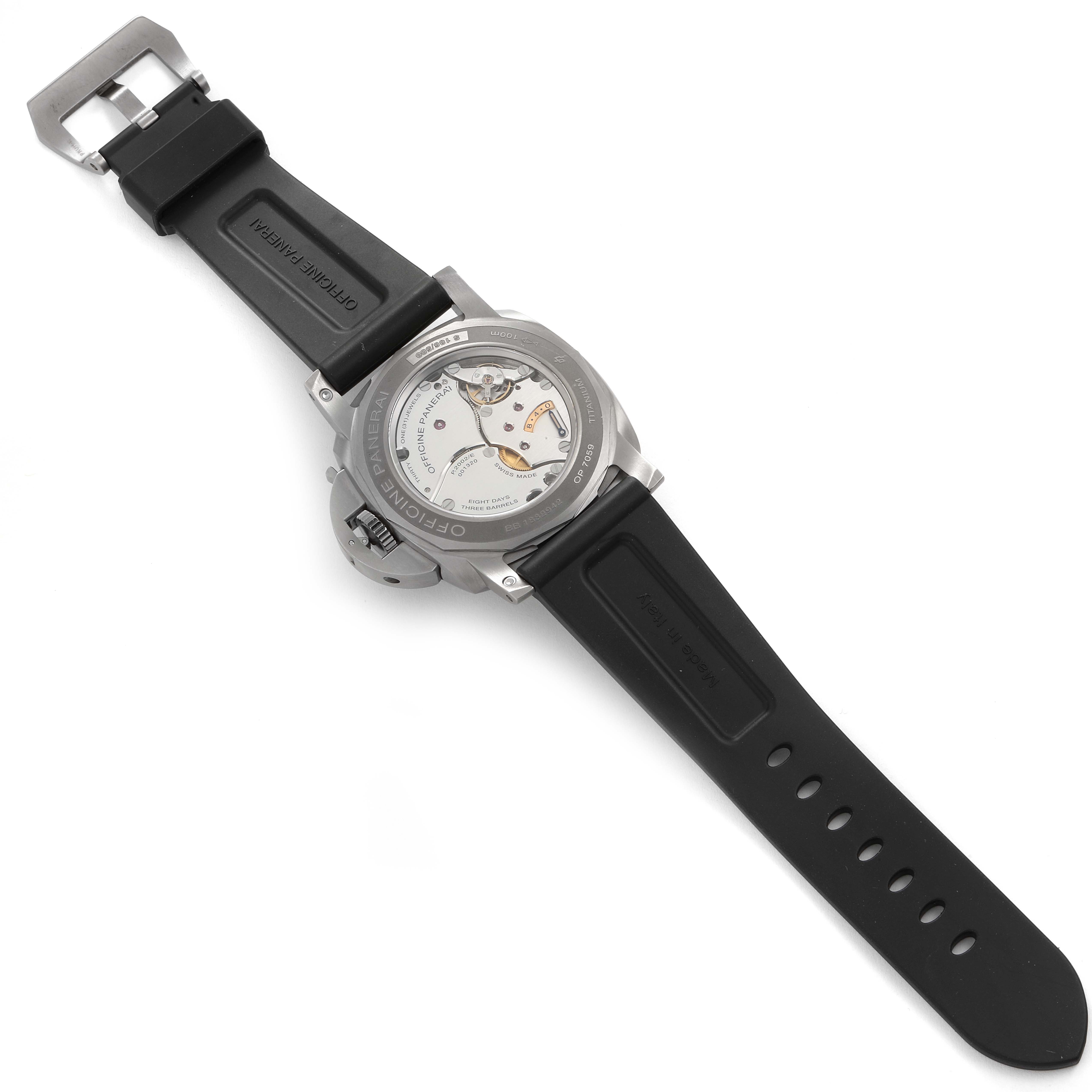 The image shows the back view of the Luminor watch by Panerai, highlighting the movement and the black rubber strap.