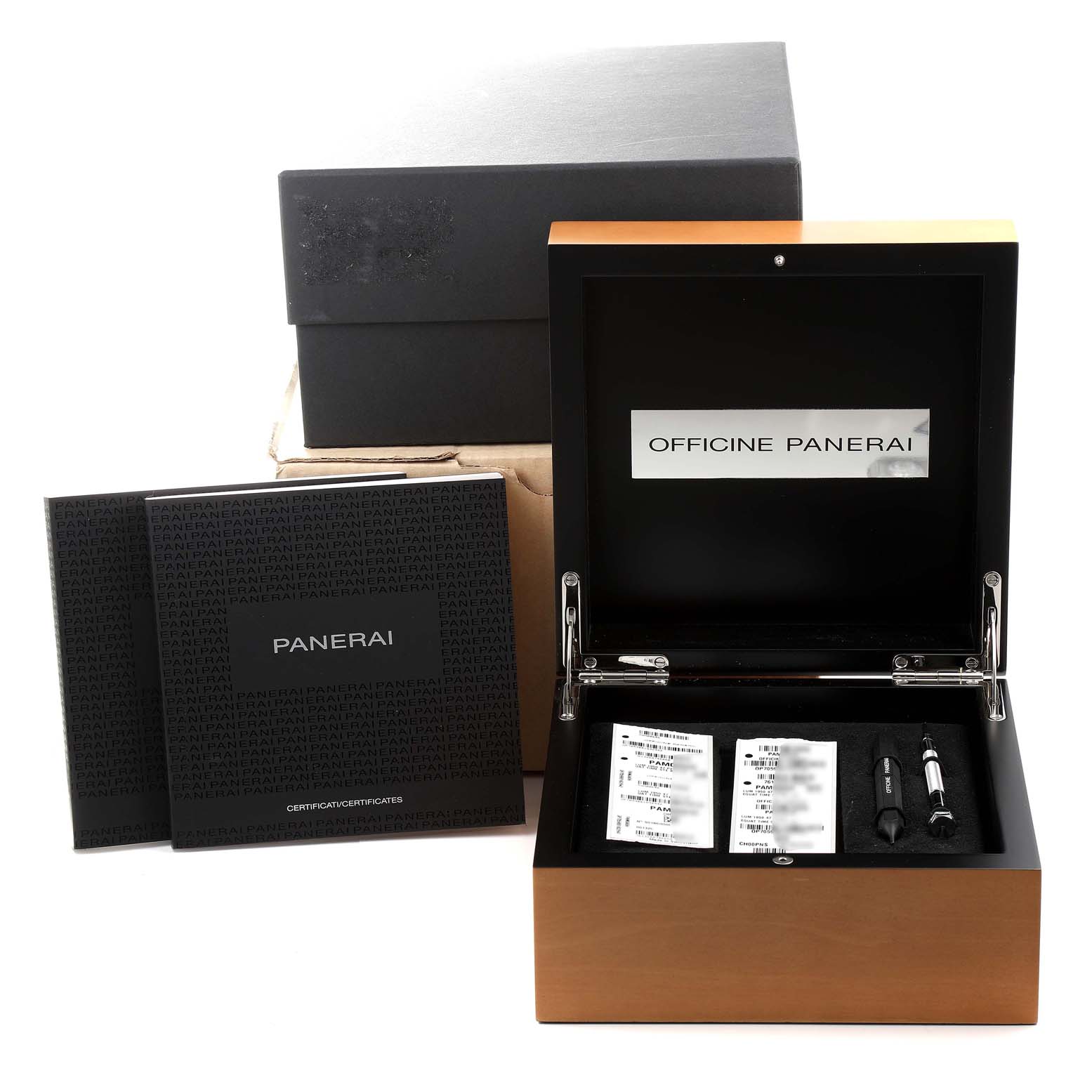 The image shows the packaging and accessories for a Panerai Luminor PAM00656 Men
s Titanium Brown Dial PAM00656 Men
s Titanium Brown Dial watch, including manuals, a box, and tools.