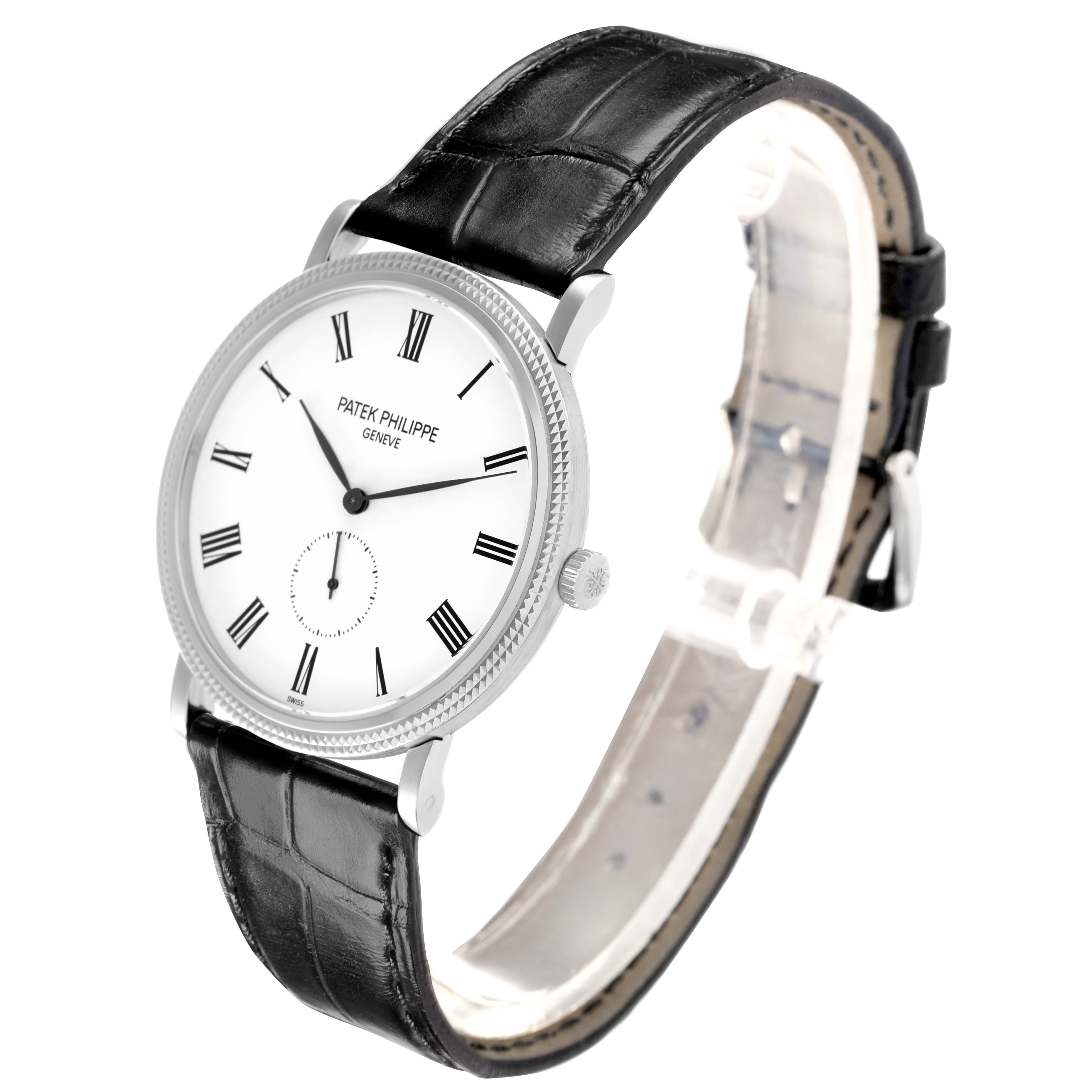 The Patek Philippe Calatrava 5119G-001 Men
s White Gold White Dial watch is shown at an angled side view, displaying the face, lugs, and part of the leather strap.