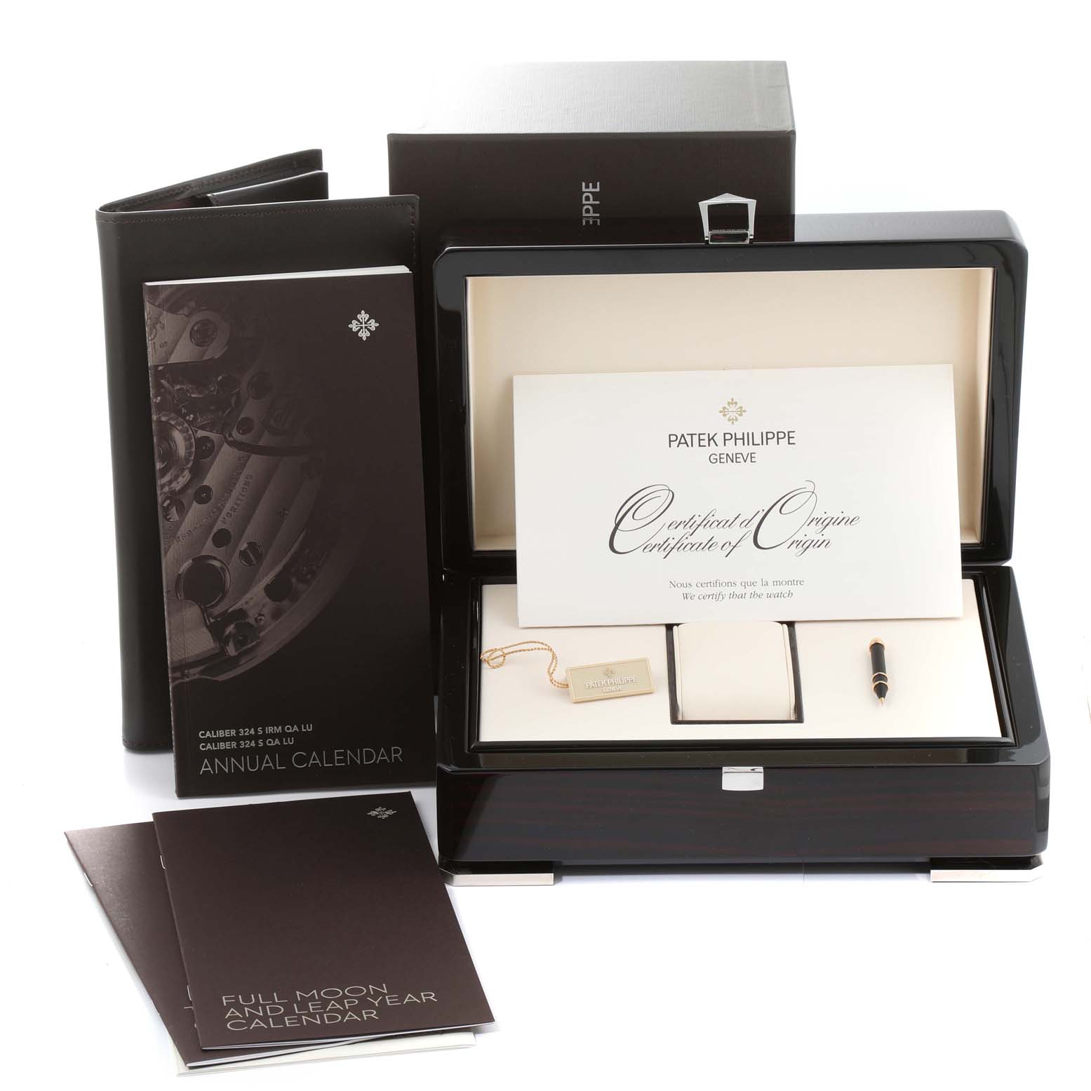 The image shows a Patek Philippe Complications 5146J-010 Men
s Yellow Gold Grey Dial watch box with a certificate, manuals, and accessories.