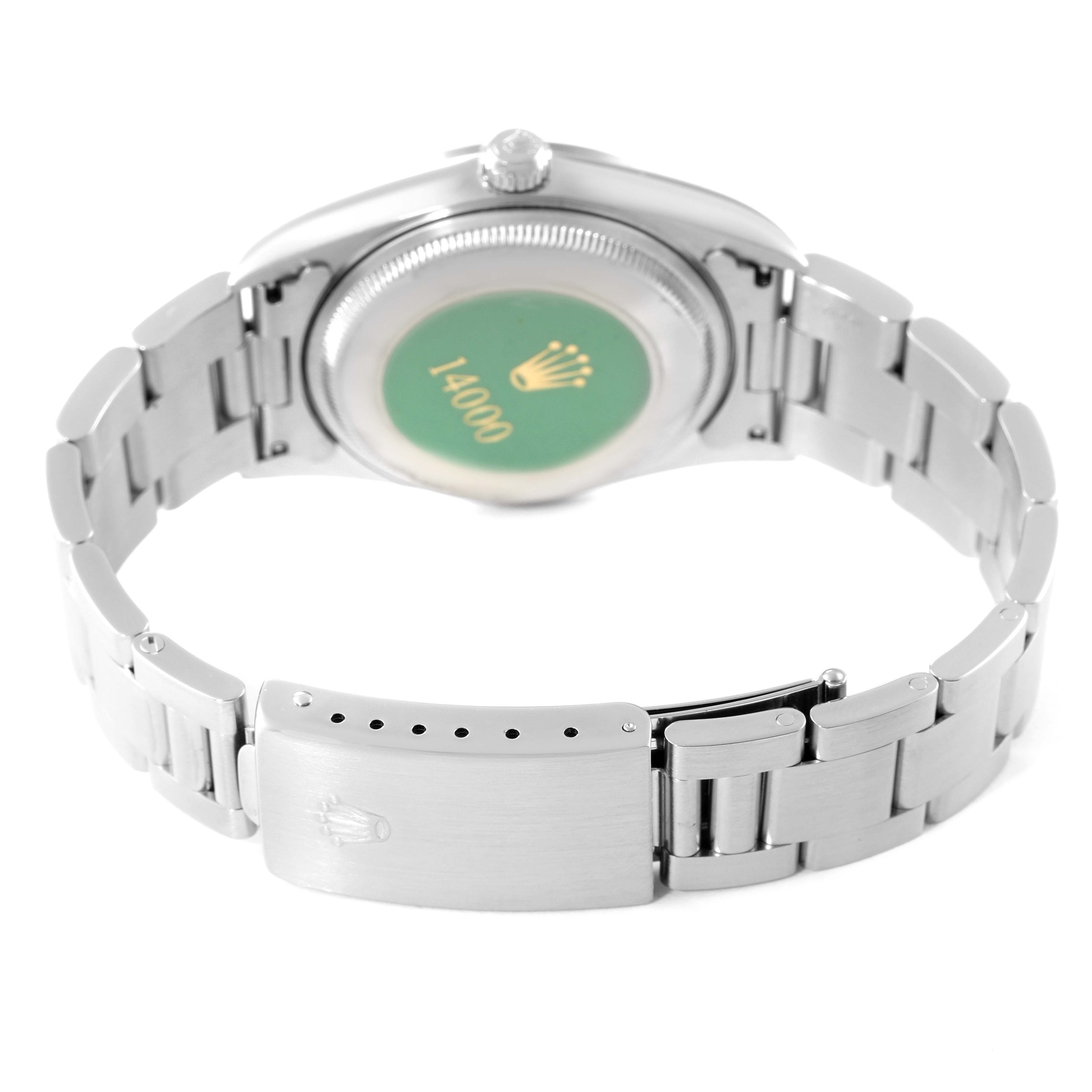 The image shows the back case and the clasp of a Rolex Air-King 14000 Men's Stainless Steel Pink Dial 14000 Men's Stainless Steel Pink Dial watch.