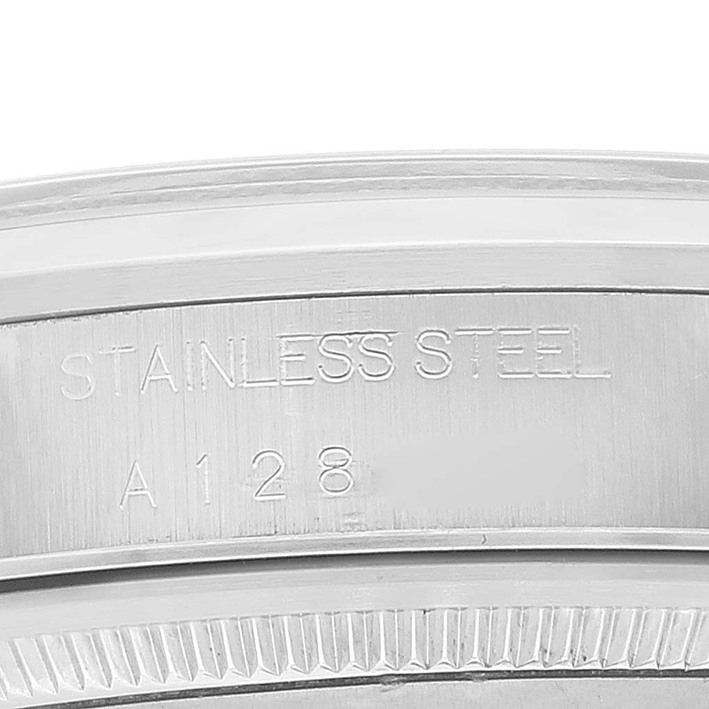 This image shows a close-up of the stainless steel case of a Rolex Air-King 14000 Men's Stainless Steel Pink Dial 14000 Men's Stainless Steel Pink Dial watch, highlighting the engravings.