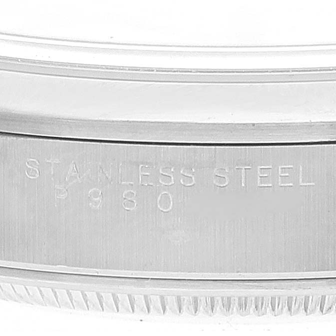 This image shows an extreme close-up of the stainless steel case side of a Rolex Air-King 14000 Men's Stainless Steel Blue Dial 14000 Men's Stainless Steel Blue Dial watch, highlighting engraved details.