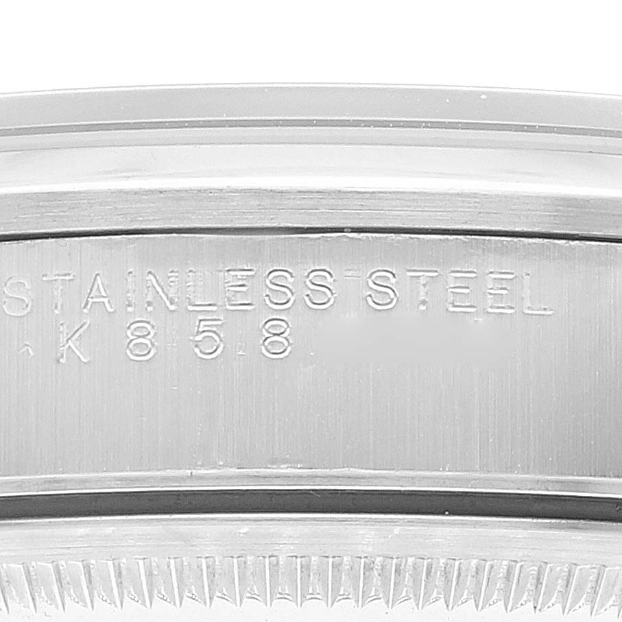 The image shows a close-up angle of the case back side of the Rolex Air-King 14000M Men's Stainless Steel Black Dial 14000M Men's Stainless Steel Black Dial watch, featuring the stainless steel stamp and model number.