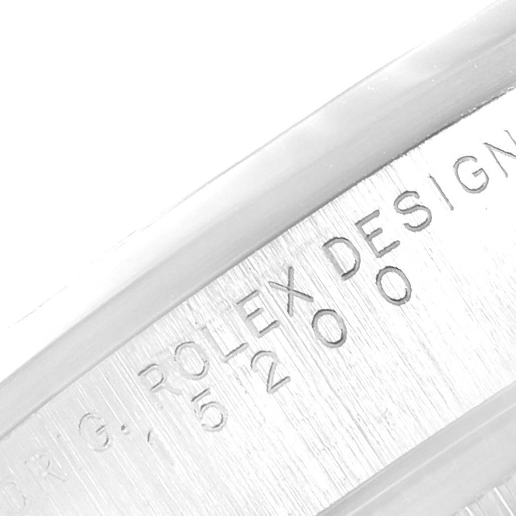 This image shows the side engraving of a Rolex Date 15200 Men's Stainless Steel Blue Dial 15200 Men's Stainless Steel Blue Dial model watch with the brand name and serial number visible.