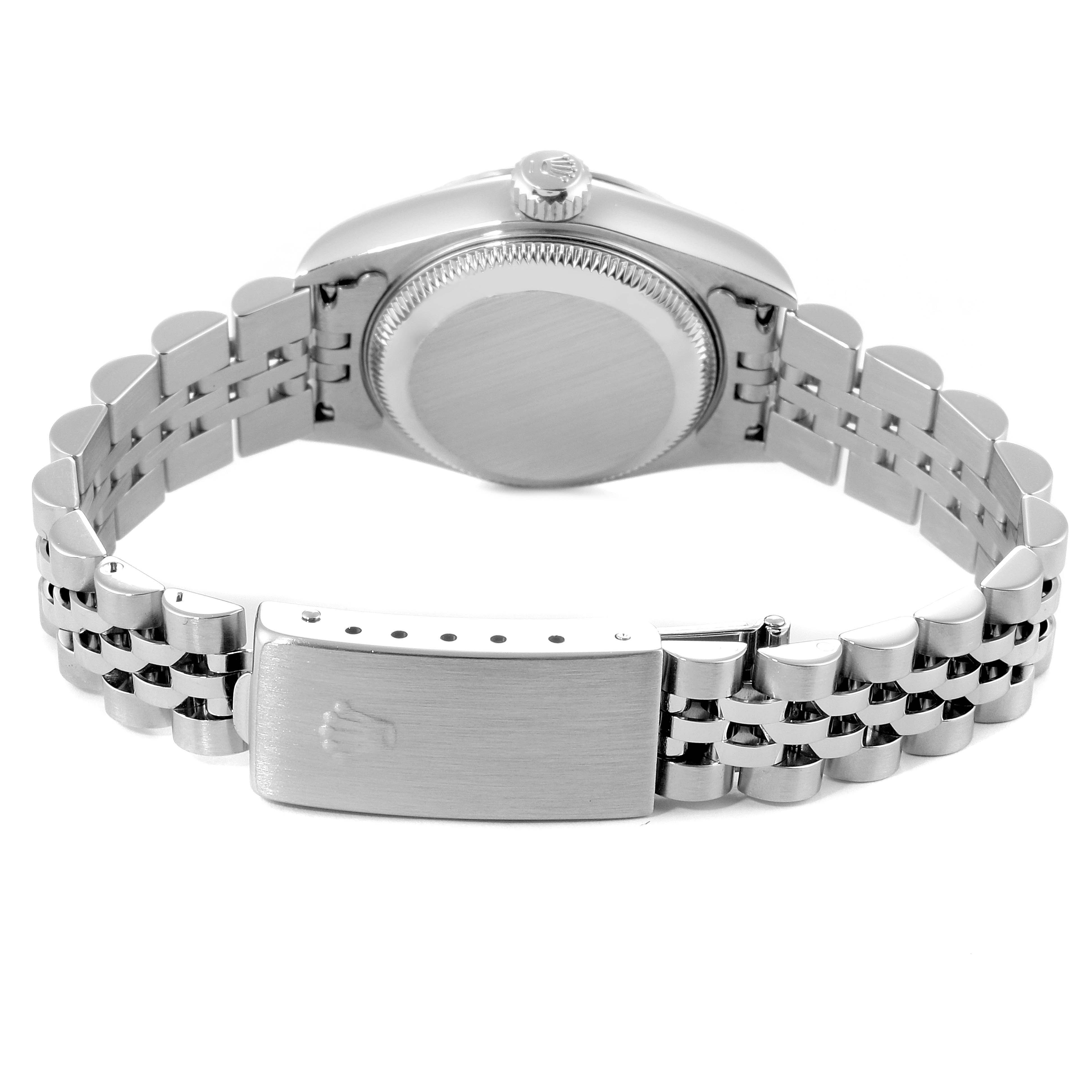 The image shows the backside of a Rolex Datejust 79174 Women's Stainless Steel Silver Dial 79174 Women's Stainless Steel Silver Dial watch, highlighting the case, crown, and bracelet clasp.