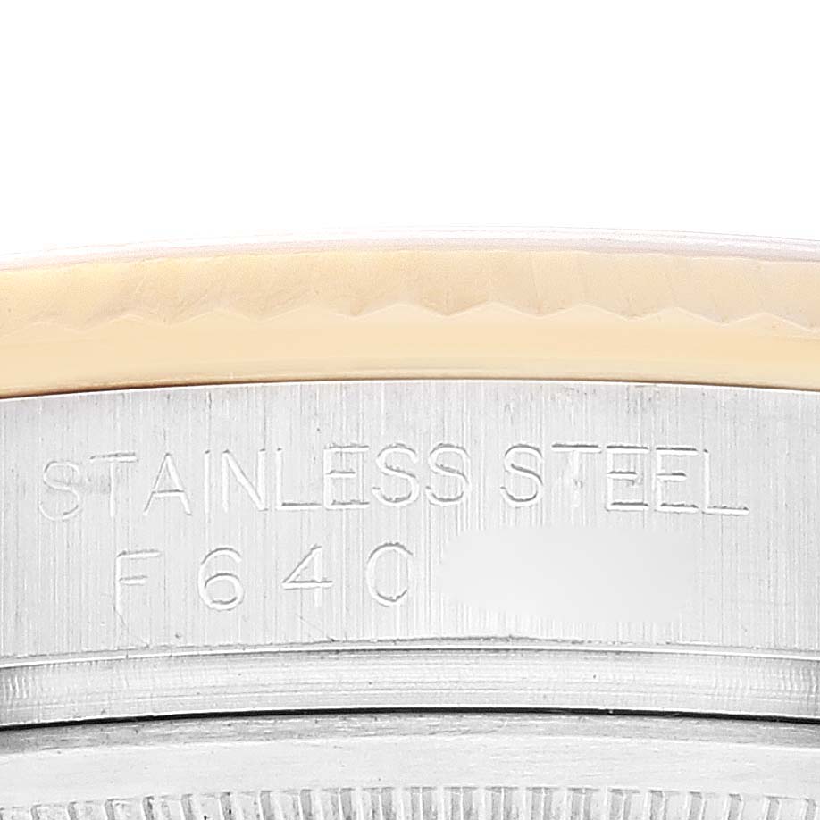 This is a close-up of the stainless steel case back engraving on a Rolex Datejust 116233 Men's Steel and Gold (two tone) Champagne Dial 116233 Men's Steel and Gold (two tone) Champagne Dial watch.