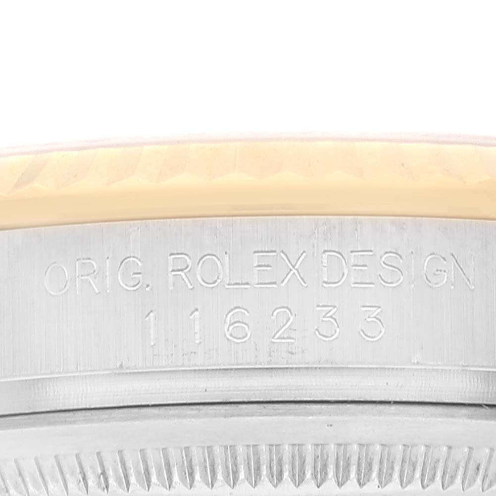 This close-up image shows the case side of a Rolex Datejust 116233 Men's Steel and Gold (two tone) Champagne Dial 116233 Men's Steel and Gold (two tone) Champagne Dial with the model number 16233 engraved.