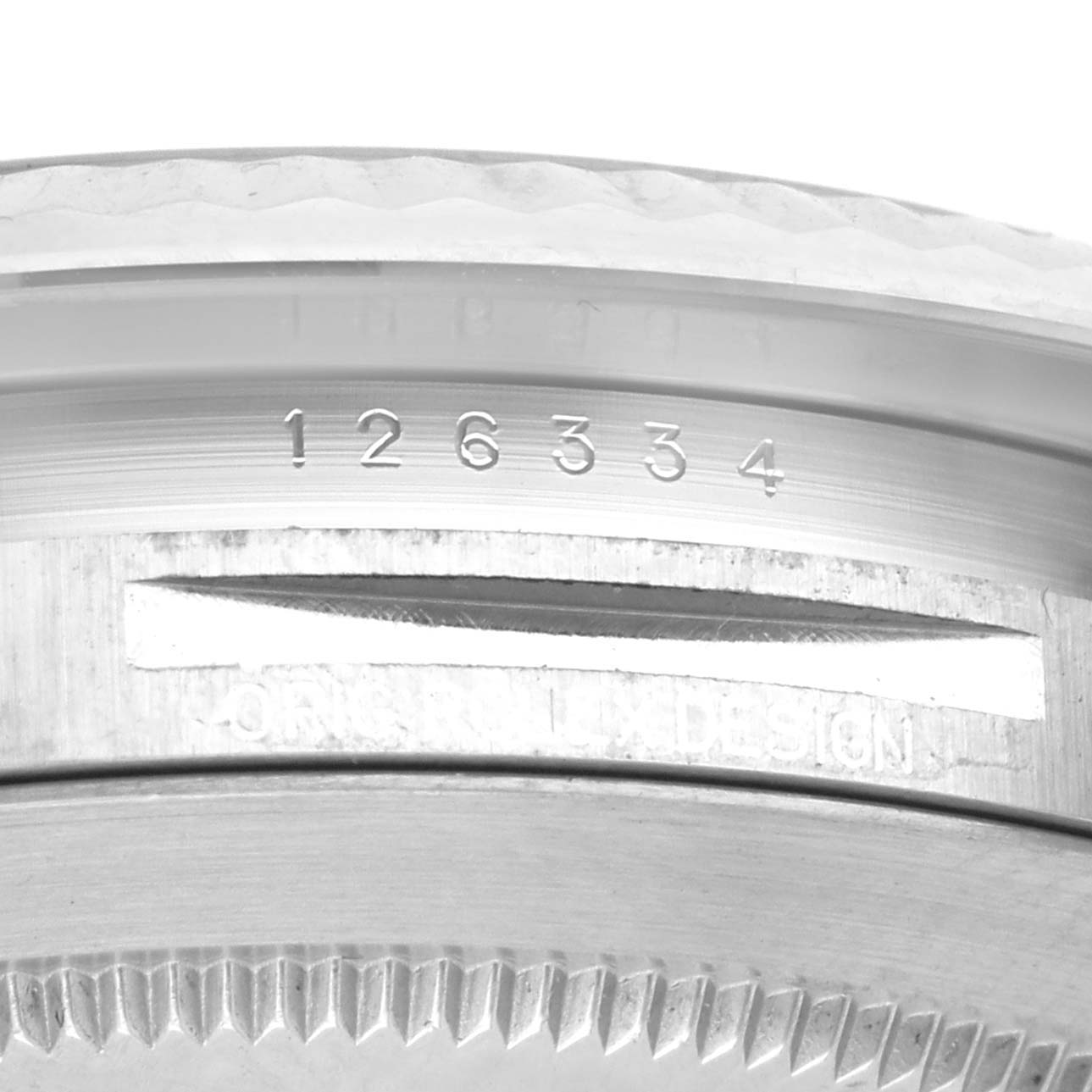 This close-up shot of the Rolex Datejust 41 126334 Men
s Stainless Steel Grey Dial 126334 Men
s Stainless Steel Grey Dial highlights the reference number and part of the case back.