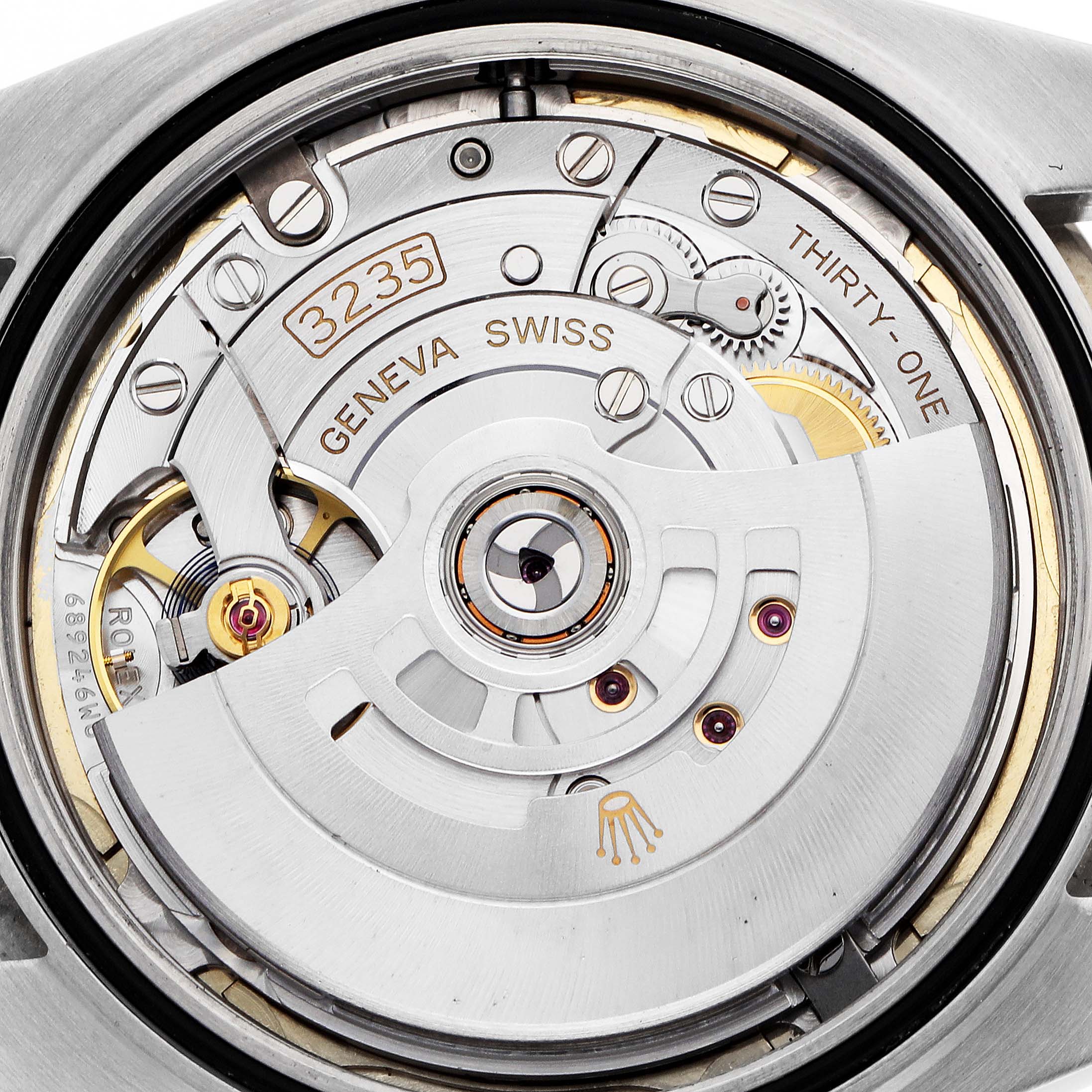 The image shows the movement of a Rolex Datejust 41 126333 Men
s Steel and Gold (two tone) Champagne Dial, featuring the rotor and intricate components.