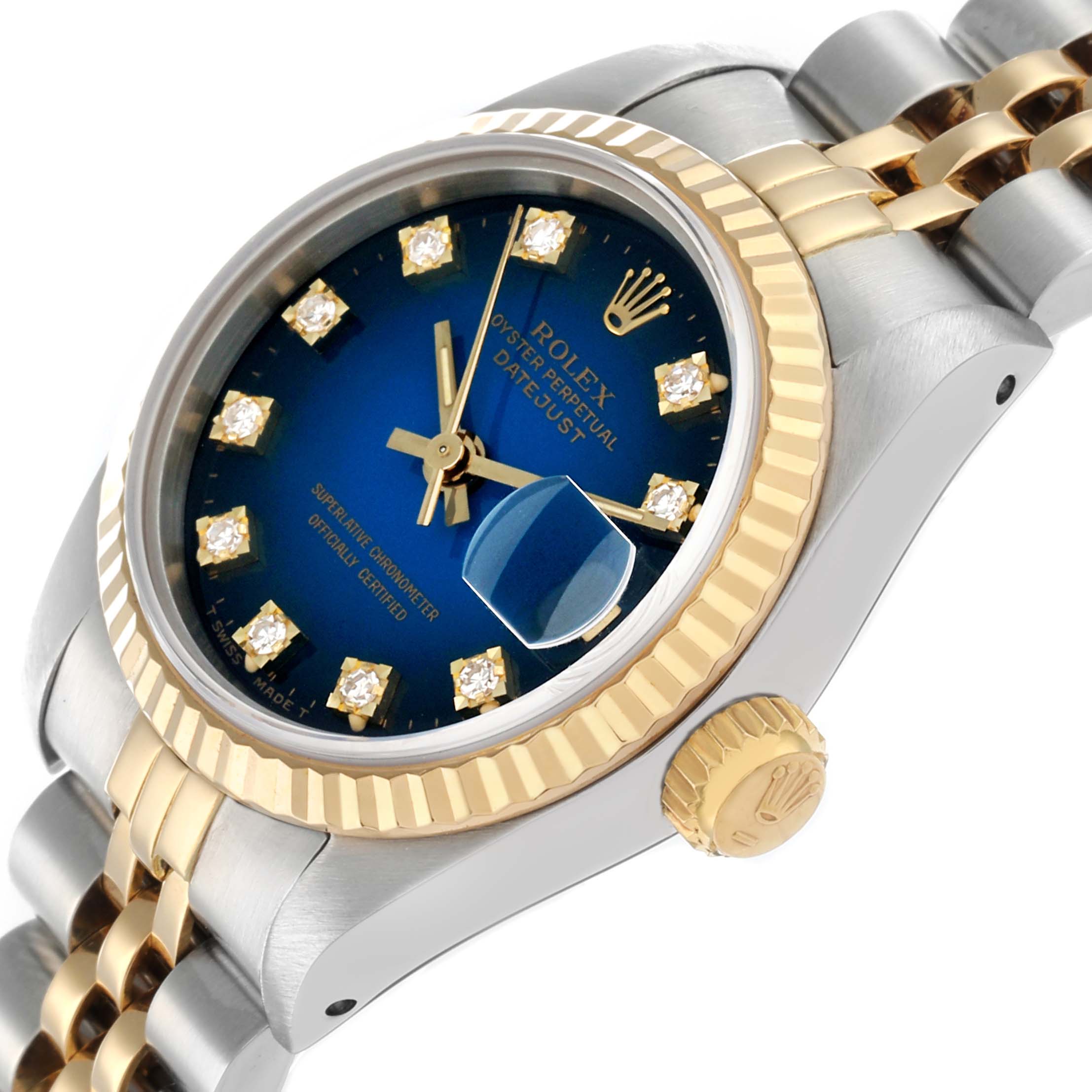 The Rolex Datejust 69173 Women
s Steel and Gold (two tone) Blue Dial watch is shown at a tilted angle, highlighting the blue dial, diamond markers, gold bezel, and two-tone bracelet.