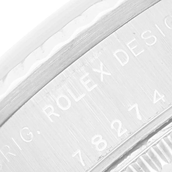 The image shows a close-up of the side of a Rolex Mid-Size 78274 Women's Stainless Steel Mother of Pearl Dial 78274 Women's Stainless Steel Mother of Pearl Dial watch, highlighting the engraved brand and model number.