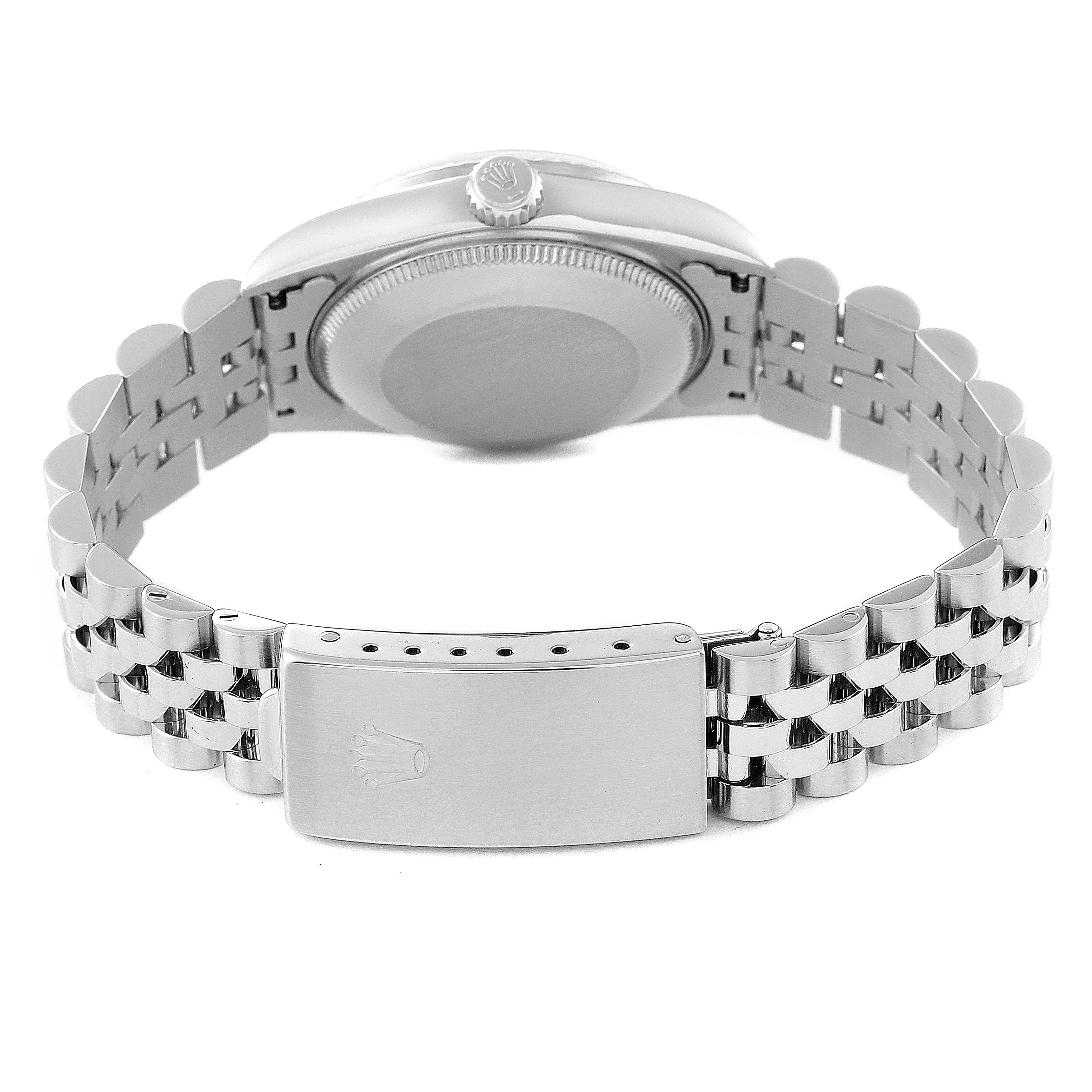 This image shows the back case and the clasp of a Mid-Size Rolex watch.