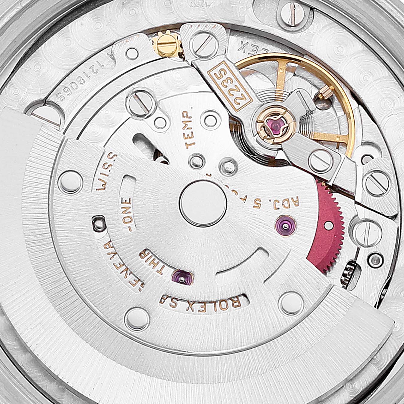 This image shows a detailed close-up of the movement and internal mechanism of a Mid-Size Rolex watch.