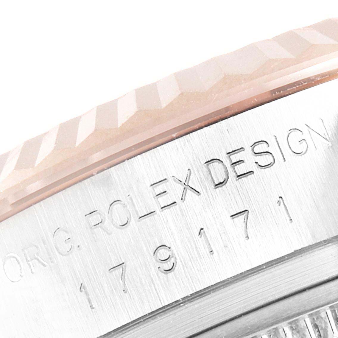 The image shows the side view of a Rolex Datejust 179171 Women's Steel and Gold (two tone) Black Dial 179171 Women's Steel and Gold (two tone) Black Dial watch, focusing on the engraved design and partial bezel.