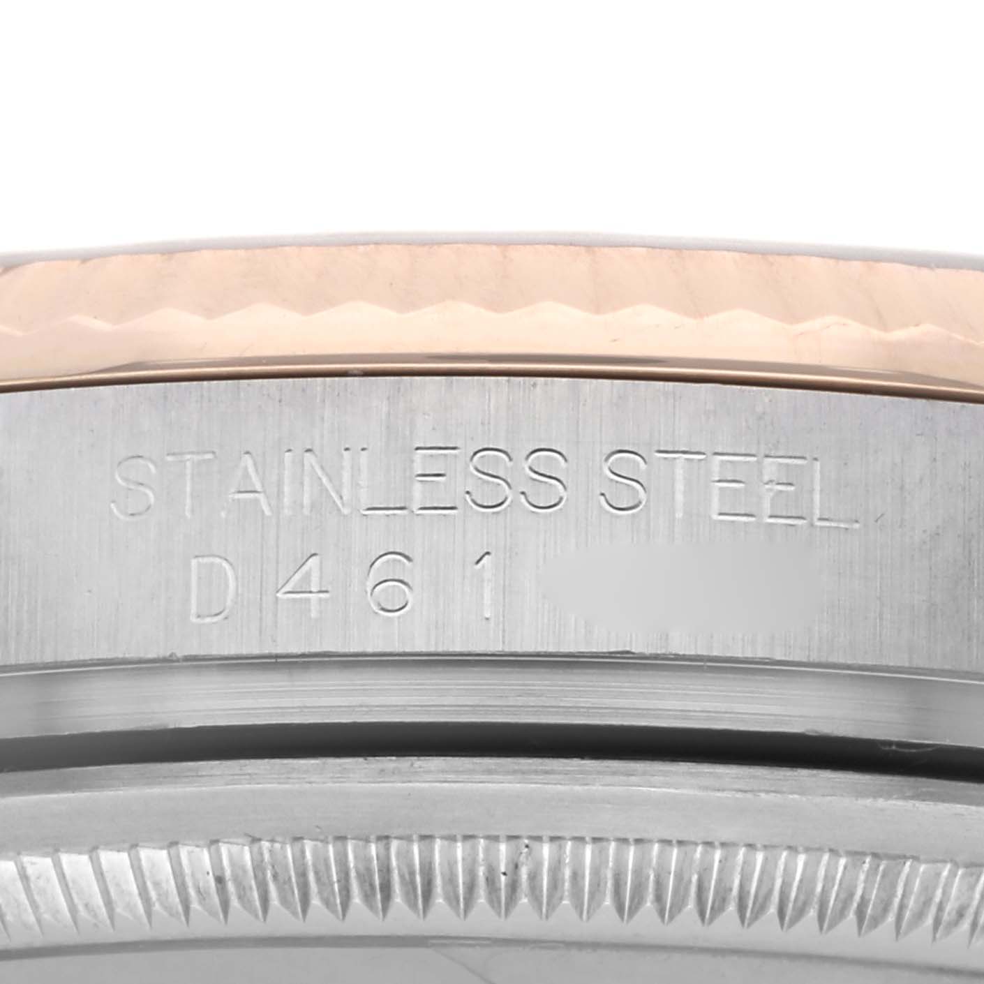 The image shows a close-up of the case side and bezel of a Rolex Datejust 116231 Men
s Steel and Gold (two tone) Mother of Pearl Dial, highlighting engraved details on the stainless steel.