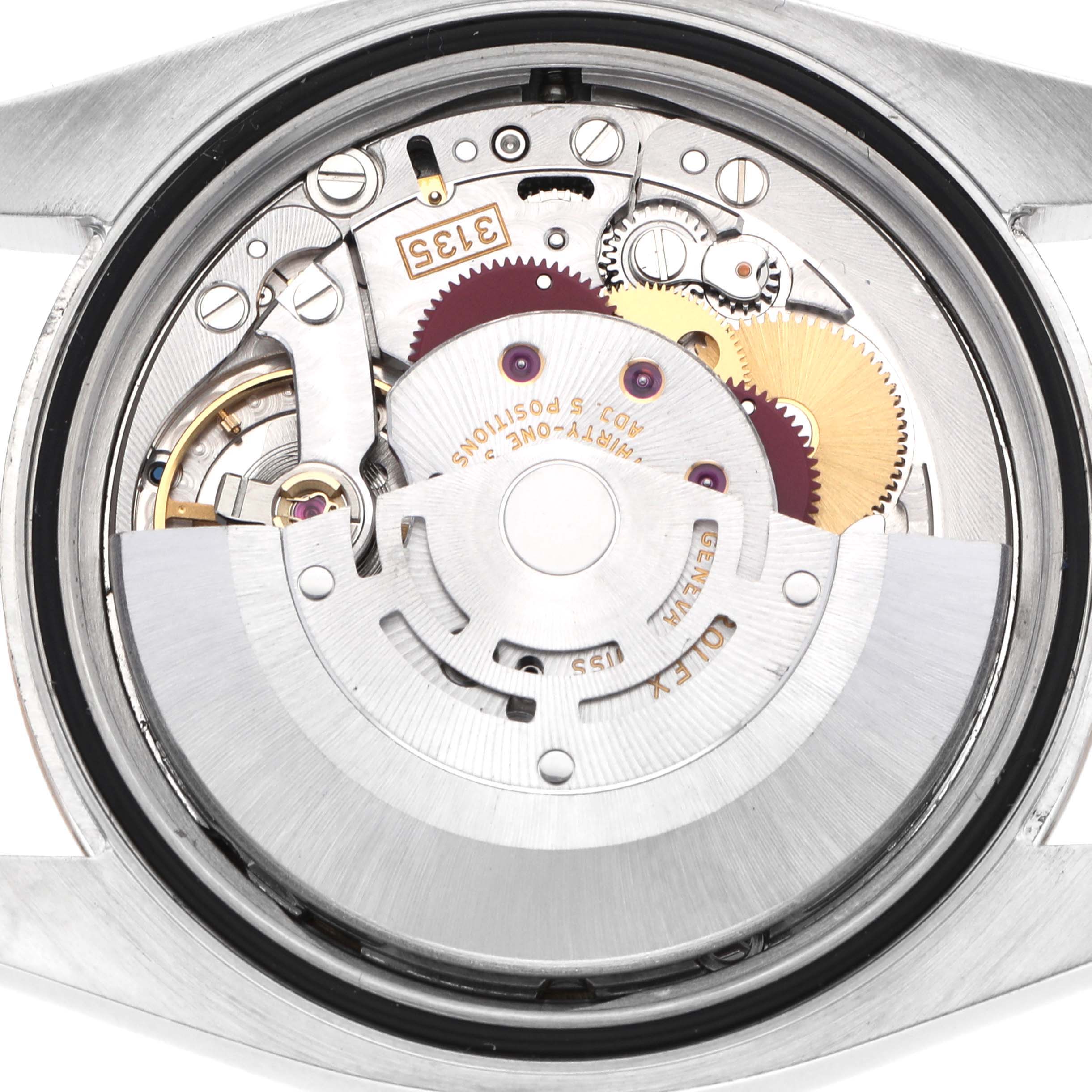 The image shows the internal mechanism of a Rolex Datejust 116231 Men
s Steel and Gold (two tone) Mother of Pearl Dial watch from a back view, highlighting gears and the rotor.