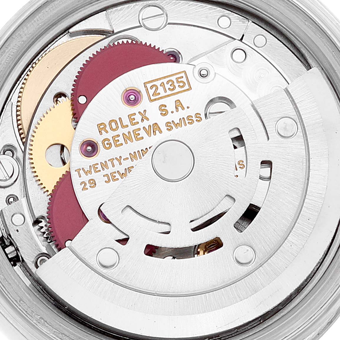 The image shows the intricate internal mechanism of a Rolex Datejust 69174 Women
s Stainless Steel Blue Dial 69174 Women
s Stainless Steel Blue Dial model, highlighting gears and the rotor from a close-up angle.