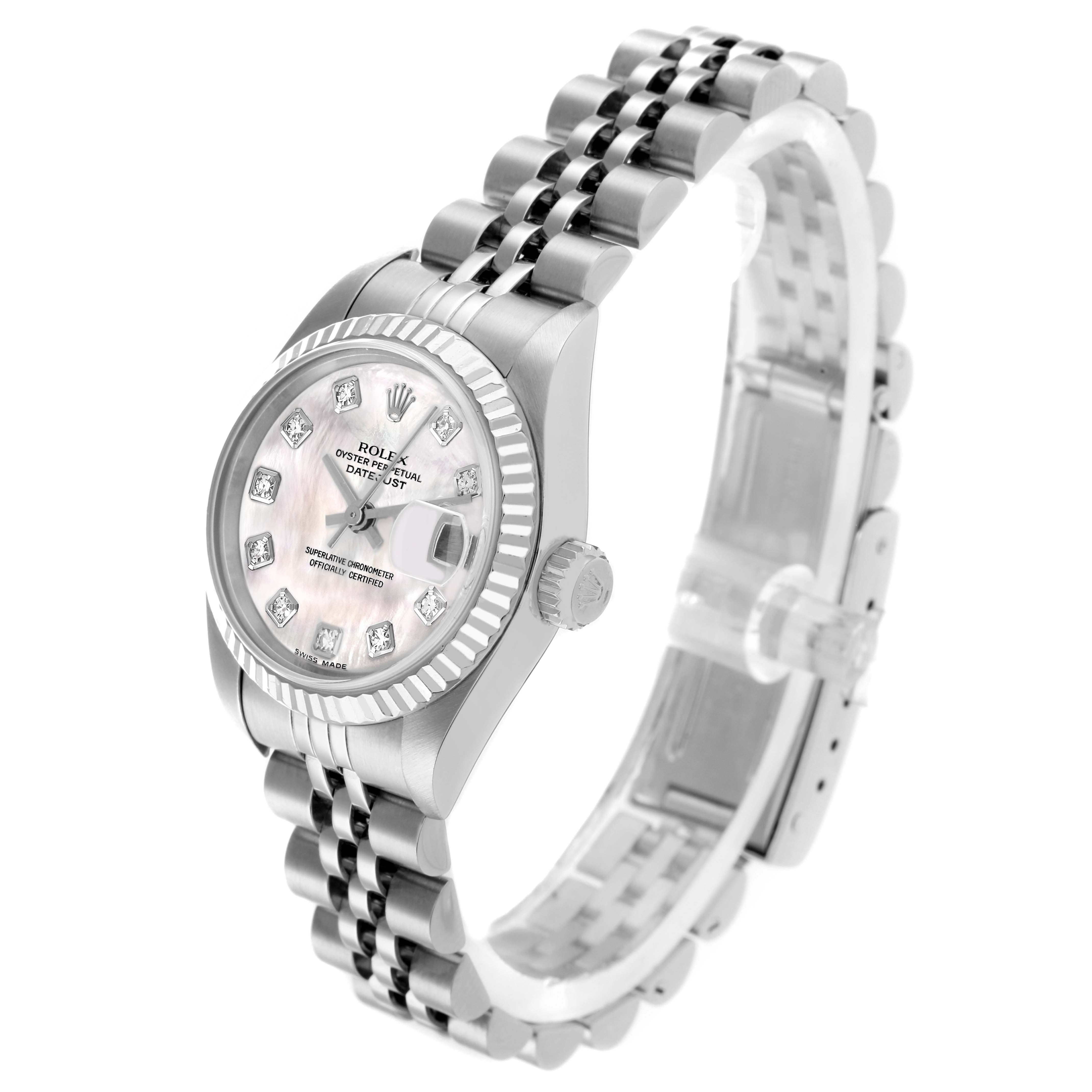 This Rolex Datejust 79174 Women
s Stainless Steel Mother of Pearl Dial watch is shown at an angle displaying the face, bezel, crown, and bracelet with a focus on its design and details.