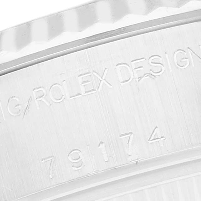 The image shows a close-up of the side engravings on a Rolex Datejust 79174 Women
s Stainless Steel Mother of Pearl Dial watch case.