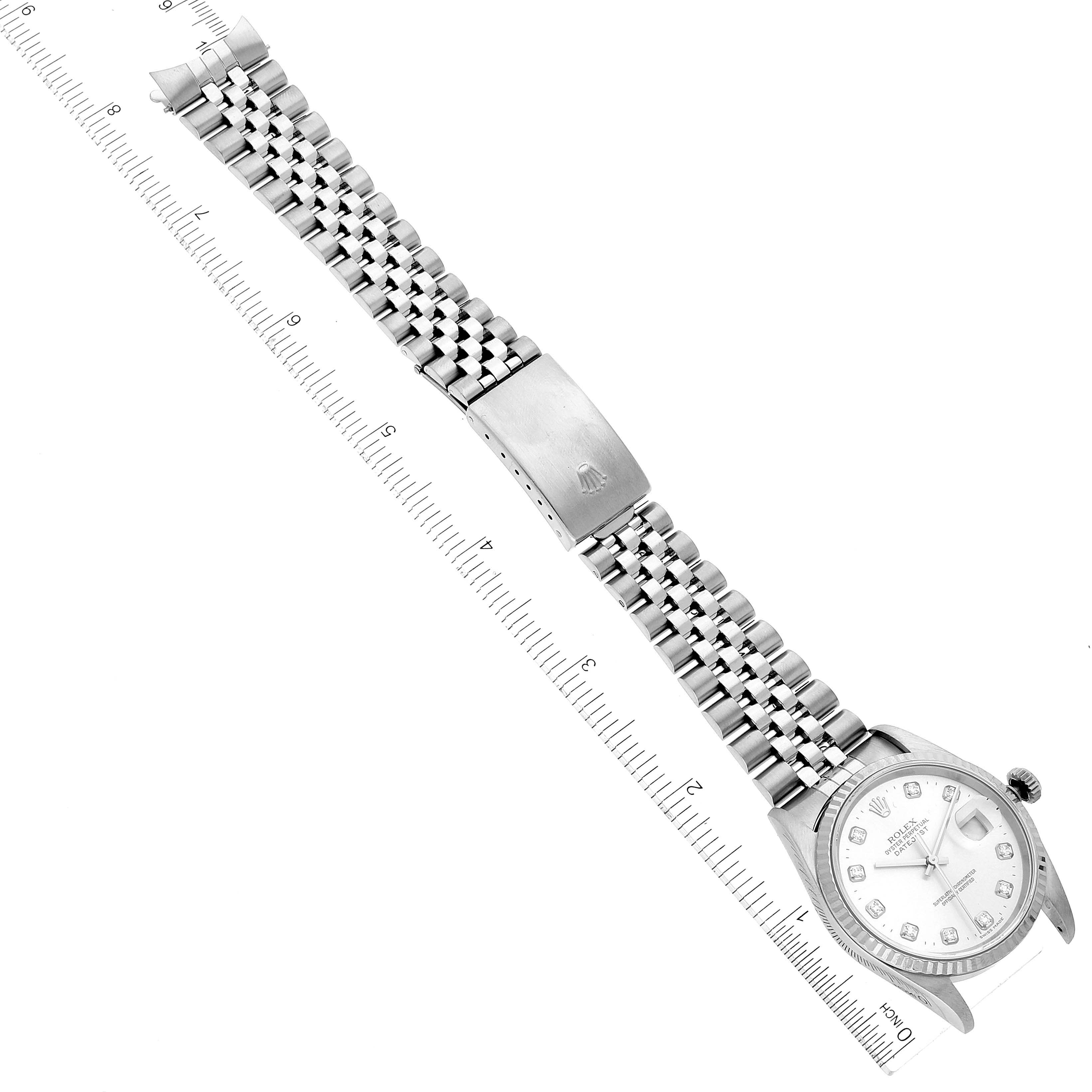 This image shows a Rolex Datejust 16234 Men's Stainless Steel Silver Dial 16234 Men's Stainless Steel Silver Dial watch from a top-down angle with its stainless steel band and clasp fully extended.