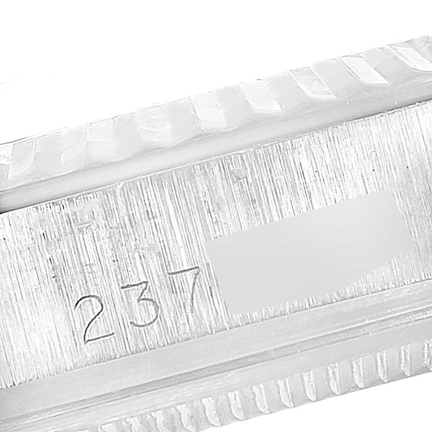 The image shows a close-up of the engraved serial number on the case edge of a Rolex Vintage Collection 1601 Men's Stainless Steel Silver Dial 1601 Men's Stainless Steel Silver Dial watch.