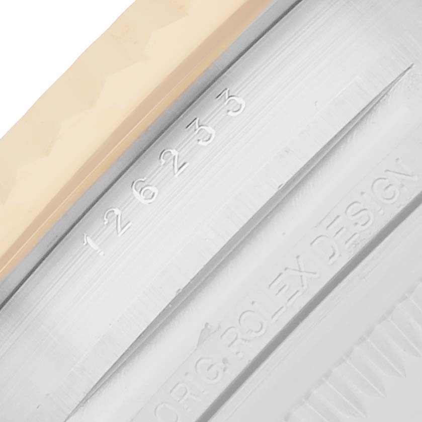 The image shows a close-up of the Rolex Datejust 126233 Men
s Steel and Gold (two tone) Black Dial watch model number engraved on the case.