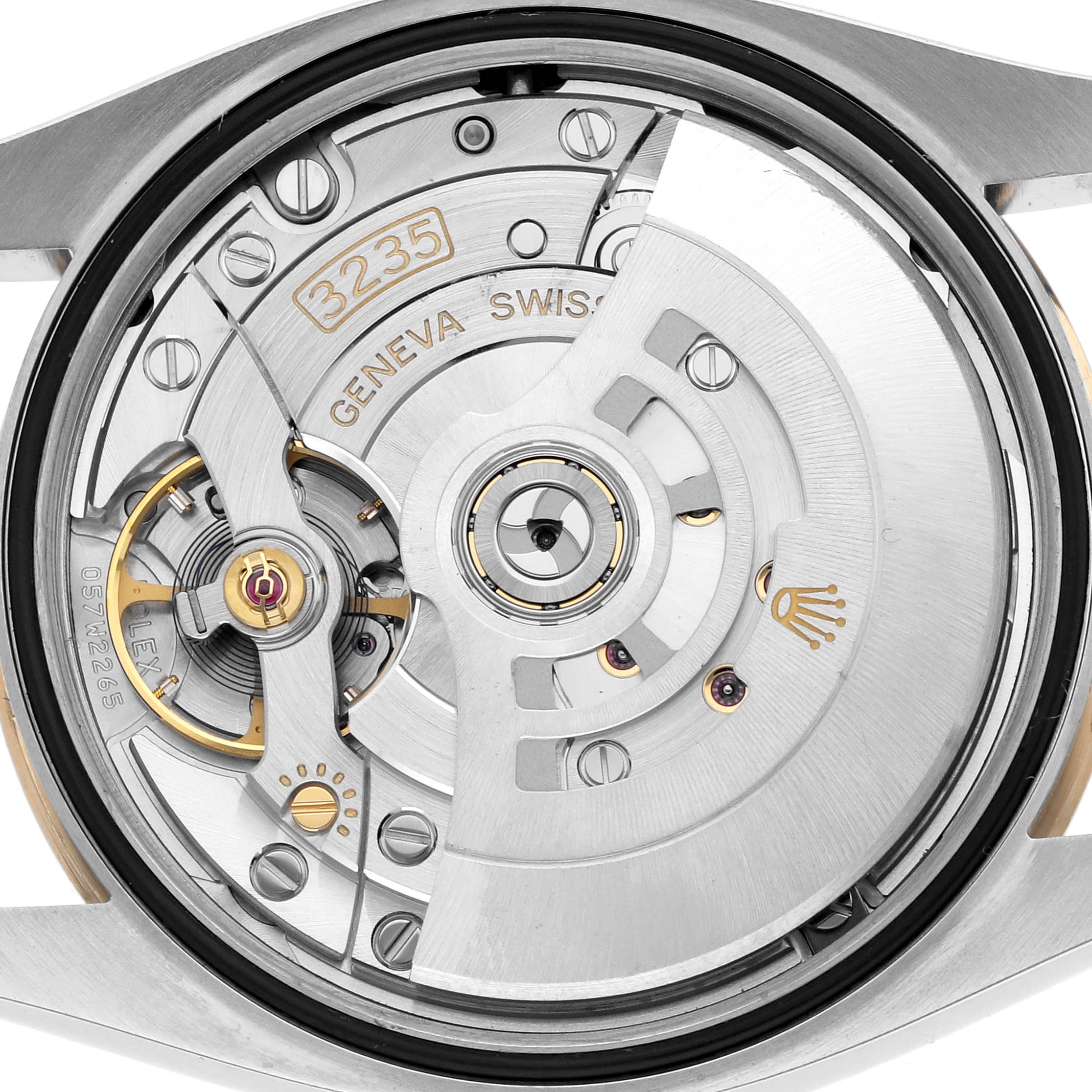The image shows the movement of a Rolex Datejust 126233 Men
s Steel and Gold (two tone) Black Dial watch, focusing on the intricate mechanics and rotor from the back.