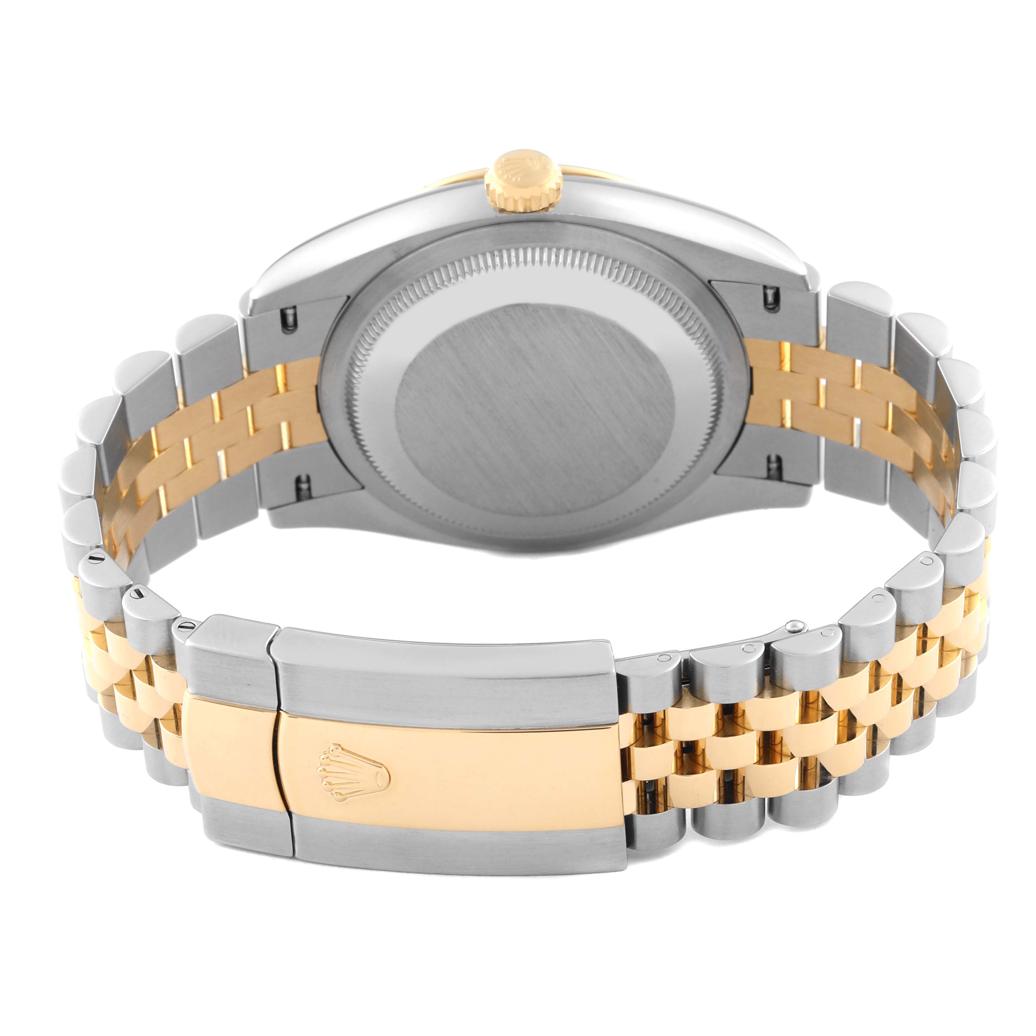 This image shows the backside and clasp of a Rolex Datejust 126233 Men
s Steel and Gold (two tone) Champagne Dial 126233 Men
s Steel and Gold (two tone) Champagne Dial watch, highlighting the bracelet and the case back.