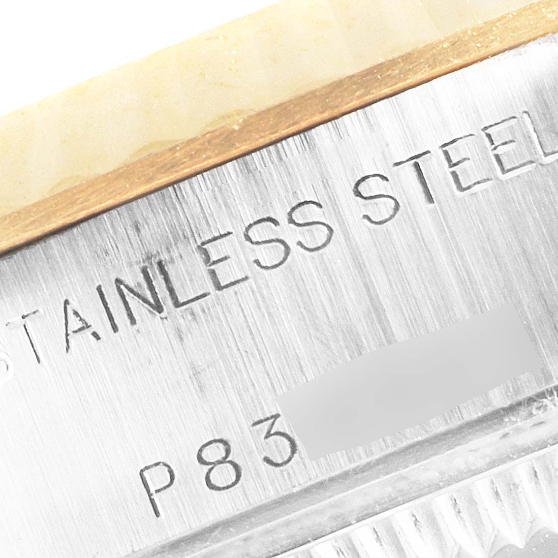 The image shows a close-up view of the stainless steel section and serial number of a Rolex Datejust 69173 Women's Steel and Gold (two tone) Champagne Dial 69173 Women's Steel and Gold (two tone) Champagne Dial watch.