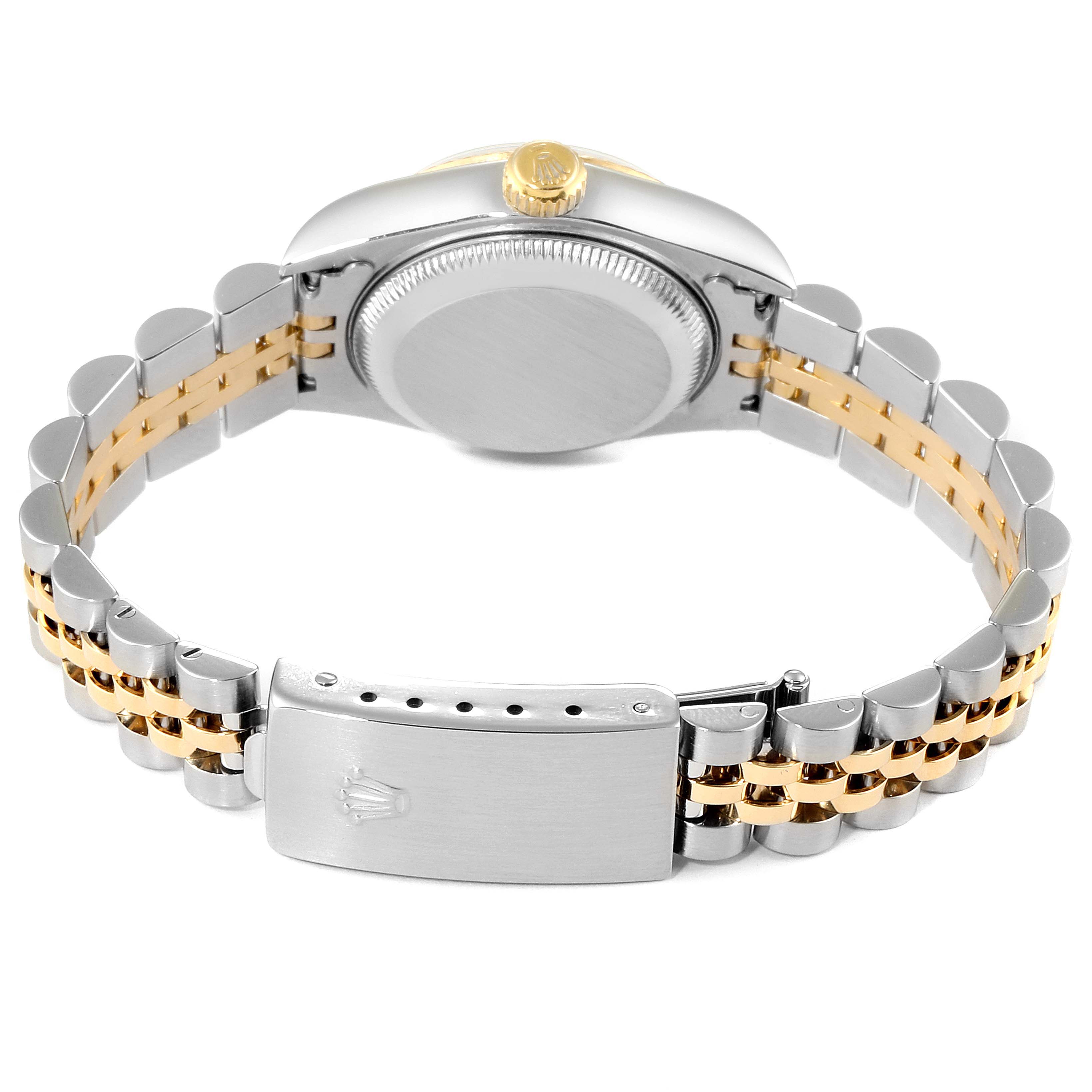 This Rolex Datejust 69173 Women's Steel and Gold (two tone) Champagne Dial 69173 Women's Steel and Gold (two tone) Champagne Dial watch is shown from the back, highlighting its two-tone metal bracelet and deployment clasp.