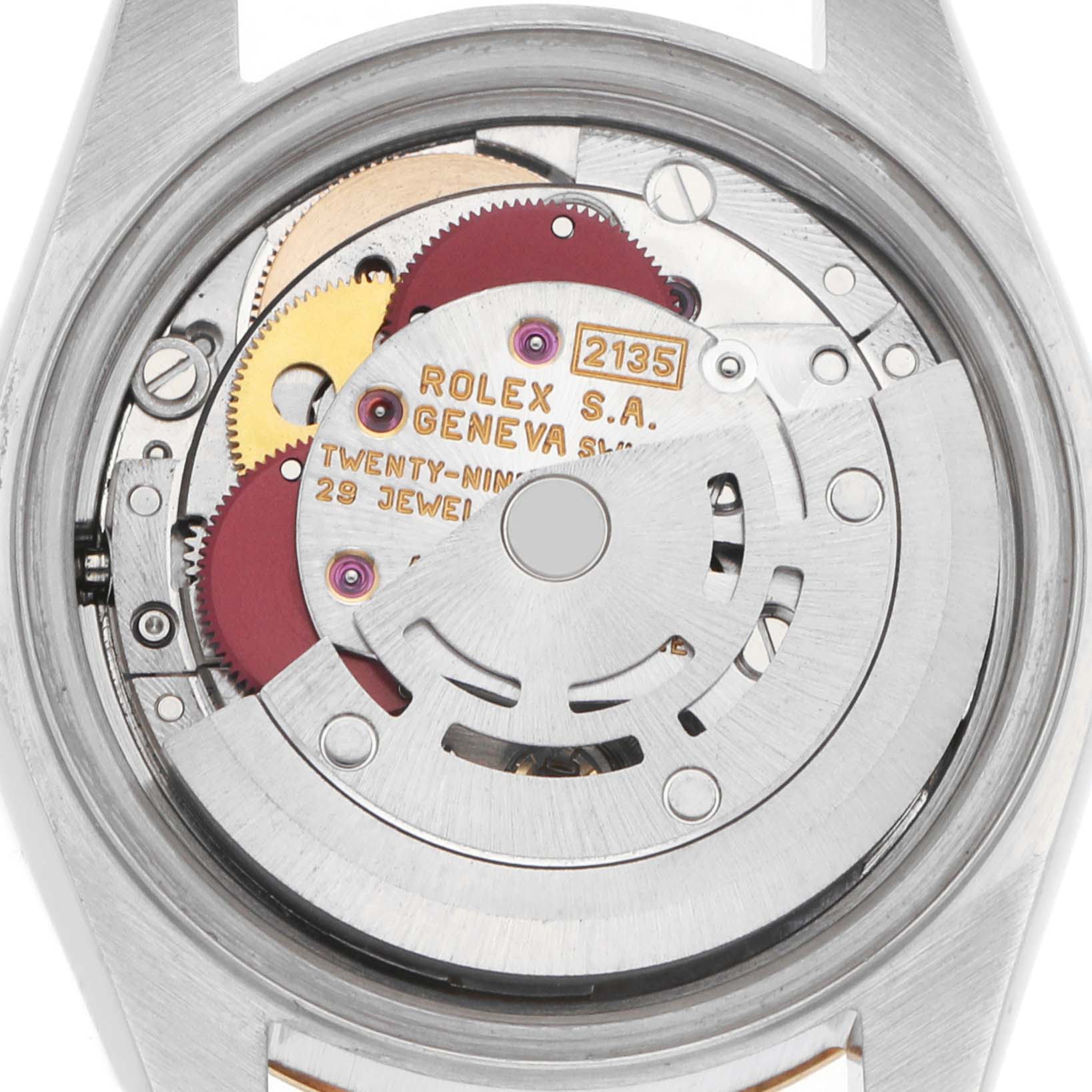 The image shows the movement of a Rolex Datejust 69173 Women
s Steel and Gold (two tone) Champagne Dial watch from the back, displaying gears and mechanisms.