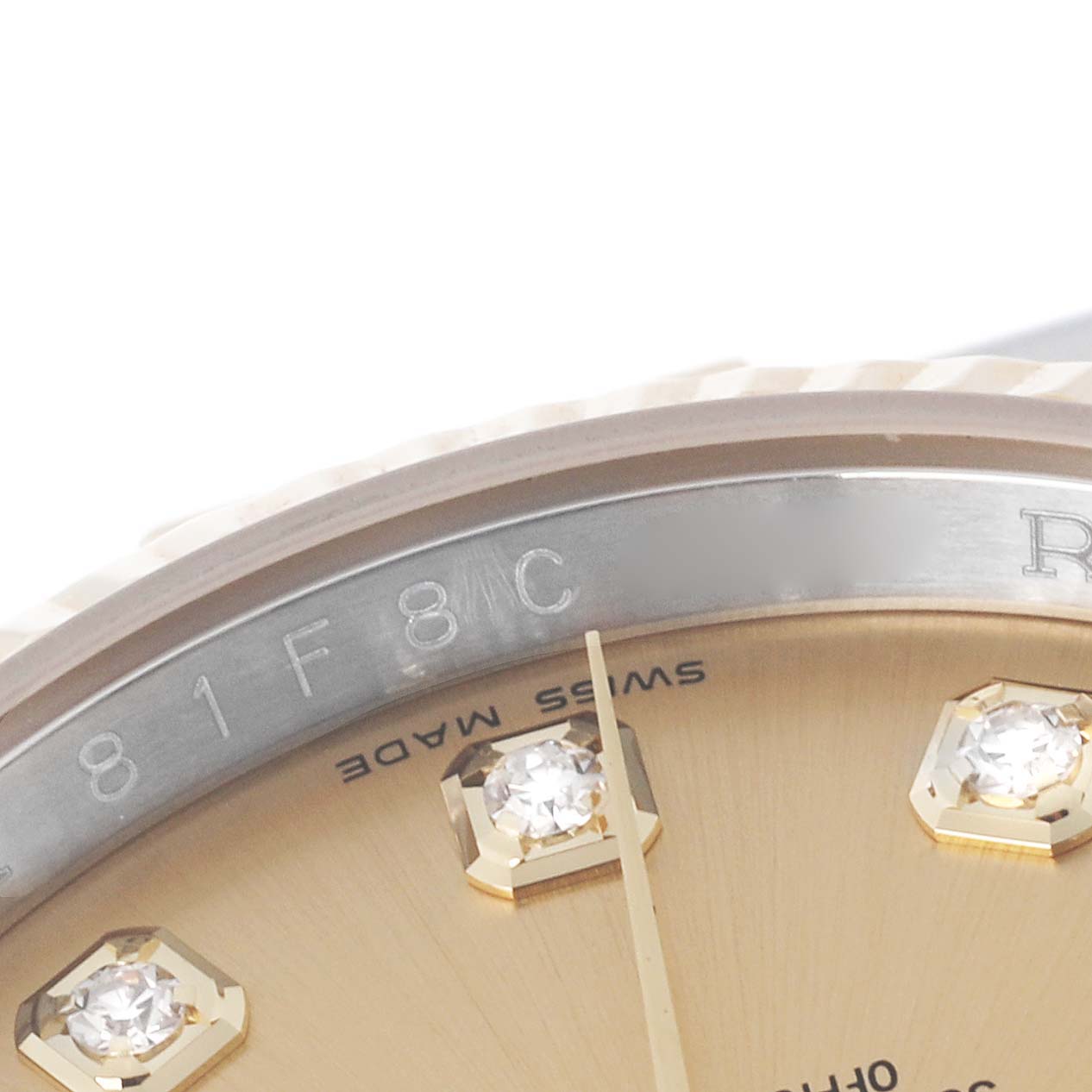 The image shows a close-up of the dial and the rehaut engraving of a Rolex Datejust 116233 Men
s Steel and Gold (two tone) Champagne Dial 116233 Men
s Steel and Gold (two tone) Champagne Dial watch with diamond hour markers.