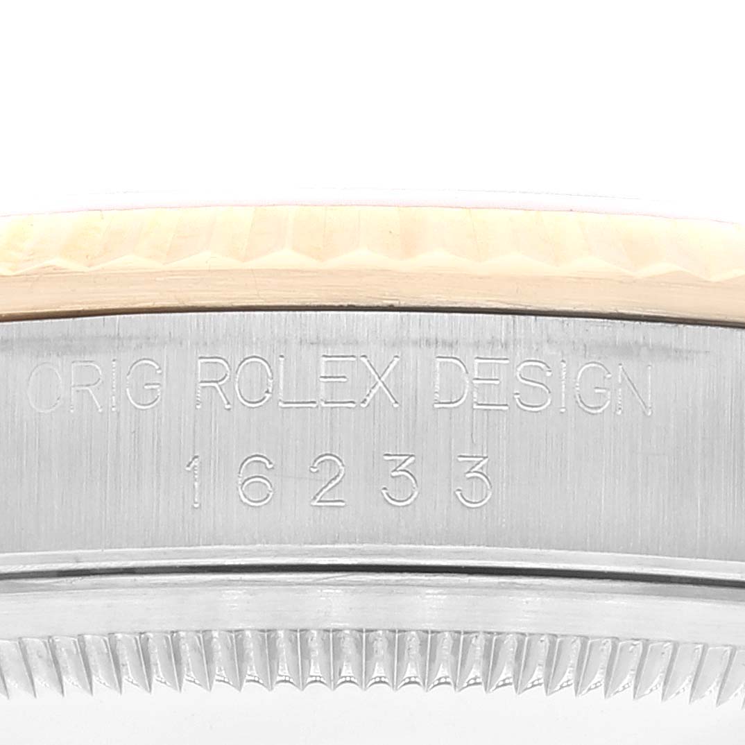 The image shows a close-up of the watch case side of a Rolex Datejust 16233 Men's Steel and Gold (two tone) Champagne Dial 16233 Men's Steel and Gold (two tone) Champagne Dial model with the model number 16233 engraved.