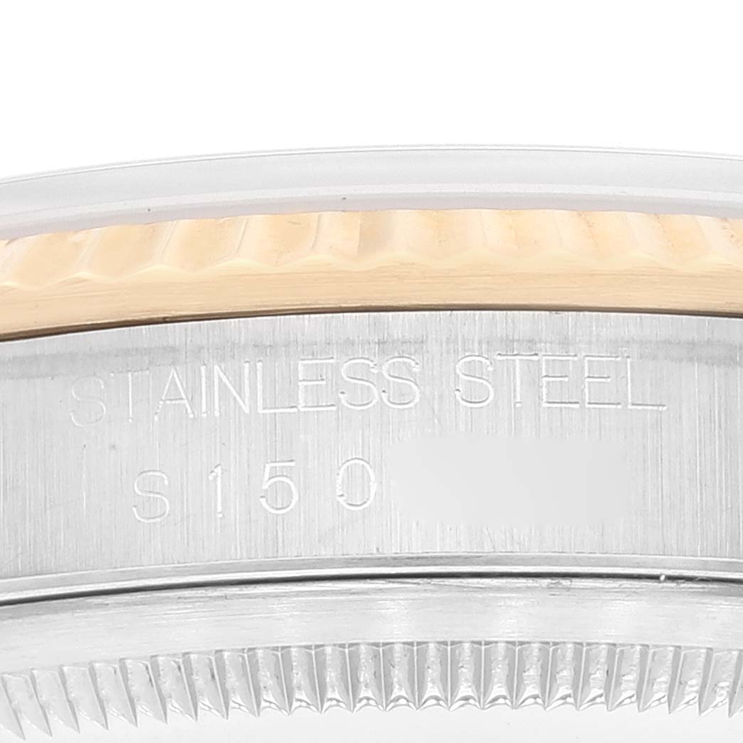 The image shows a close-up of the bezel and the side of a Rolex Datejust 16233 Men's Steel and Gold (two tone) Champagne Dial 16233 Men's Steel and Gold (two tone) Champagne Dial watch with "Stainless Steel S150" engraved.