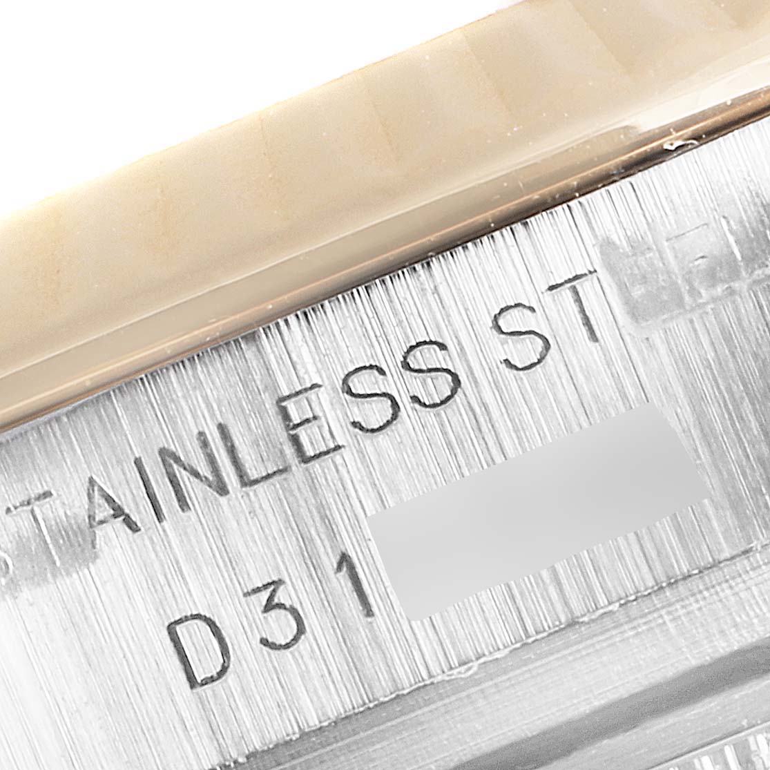 This close-up image shows the engraving on the stainless steel case of a Rolex Datejust 179173 Women's Steel and Gold (two tone) Mother of Pearl Dial 179173 Women's Steel and Gold (two tone) Mother of Pearl Dial watch.