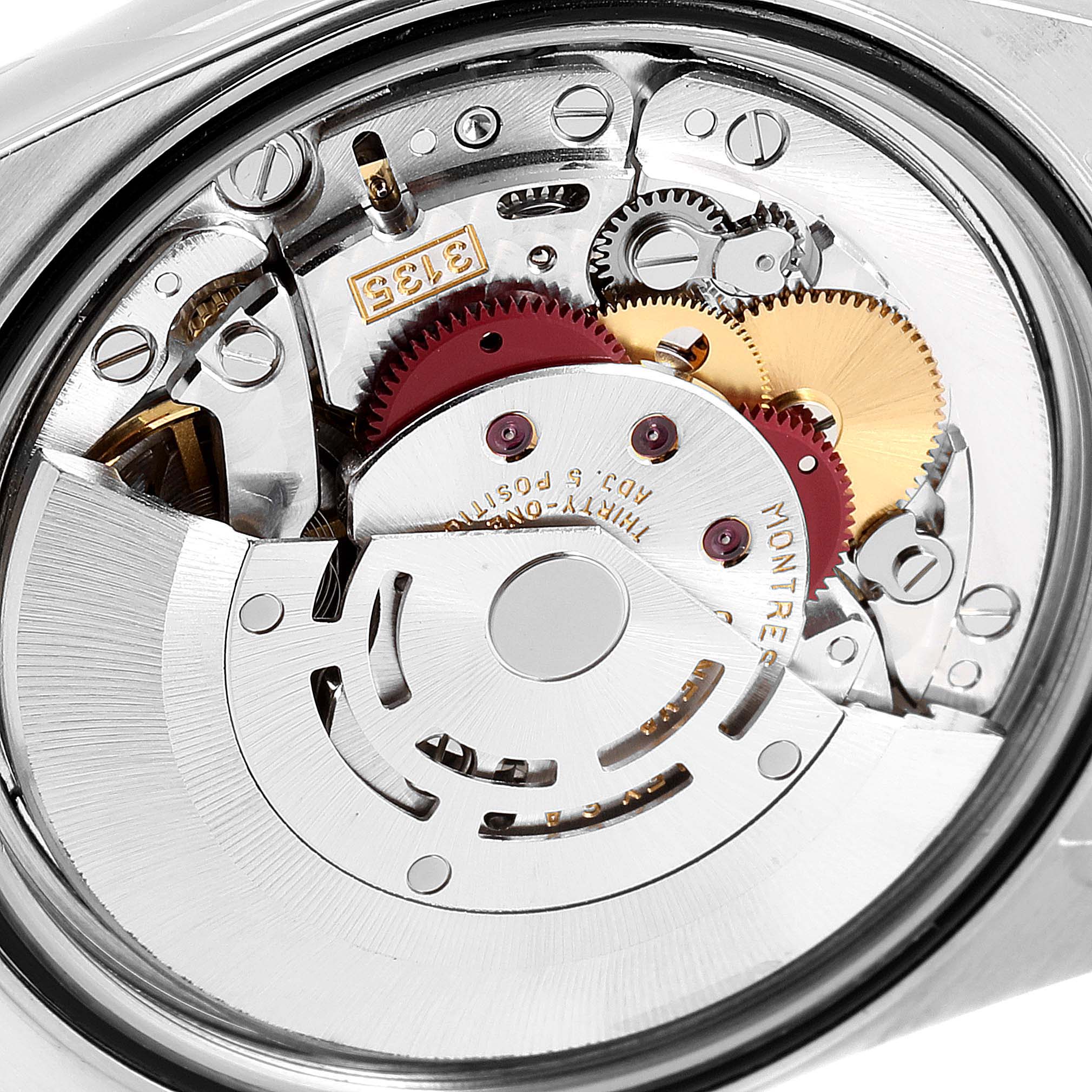 This is a close-up view of the inner movement mechanism of a Rolex Datejust 16233 Men's Steel and Gold (two tone) Silver Dial 16233 Men's Steel and Gold (two tone) Silver Dial watch.