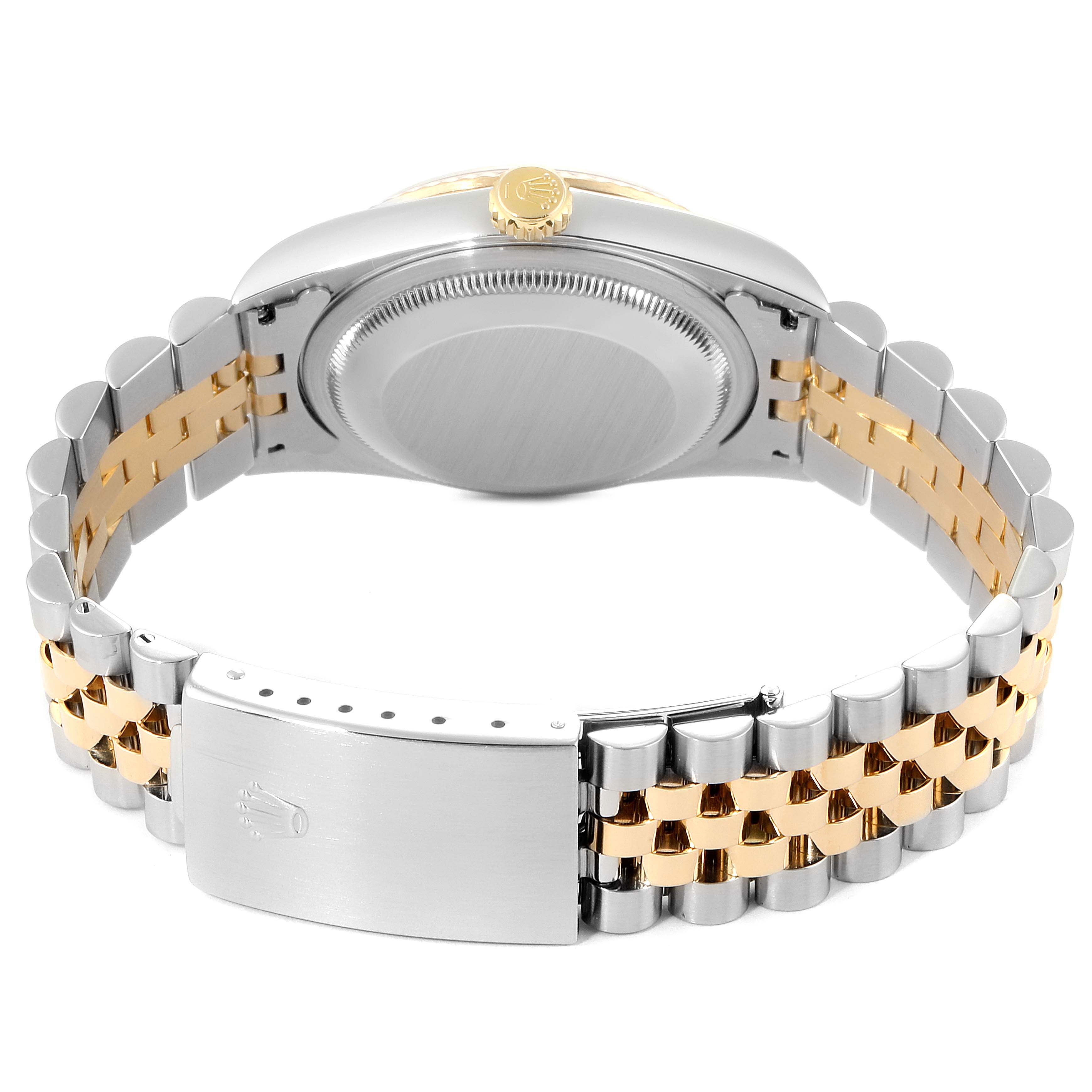 The image shows the back view of a Rolex Datejust 16233 Men
s Steel and Gold (two tone) White Dial 16233 Men
s Steel and Gold (two tone) White Dial watch, highlighting its case back, winding crown, and two-tone bracelet.