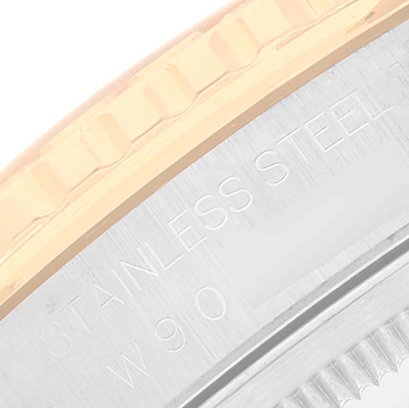 This close-up image shows the engraved stainless steel case and part of the bezel of a Rolex Turn-o-Graph 16263 Men's Steel and Gold (two tone) Black Dial 16263 Men's Steel and Gold (two tone) Black Dial watch.