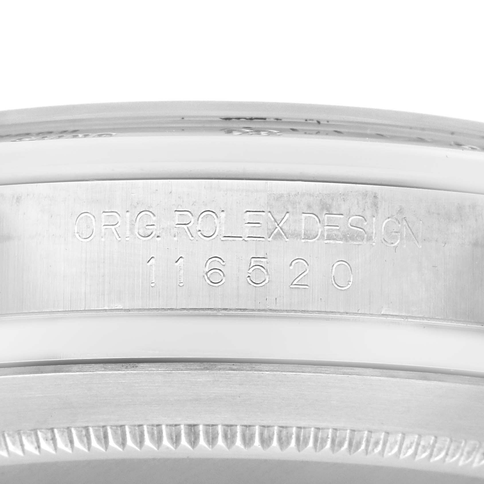 This image shows a close-up of the side of the bezel and case with engraving on a Rolex Daytona 116520 Men's Stainless Steel White Dial 116520 Men's Stainless Steel White Dial watch, model 116520.