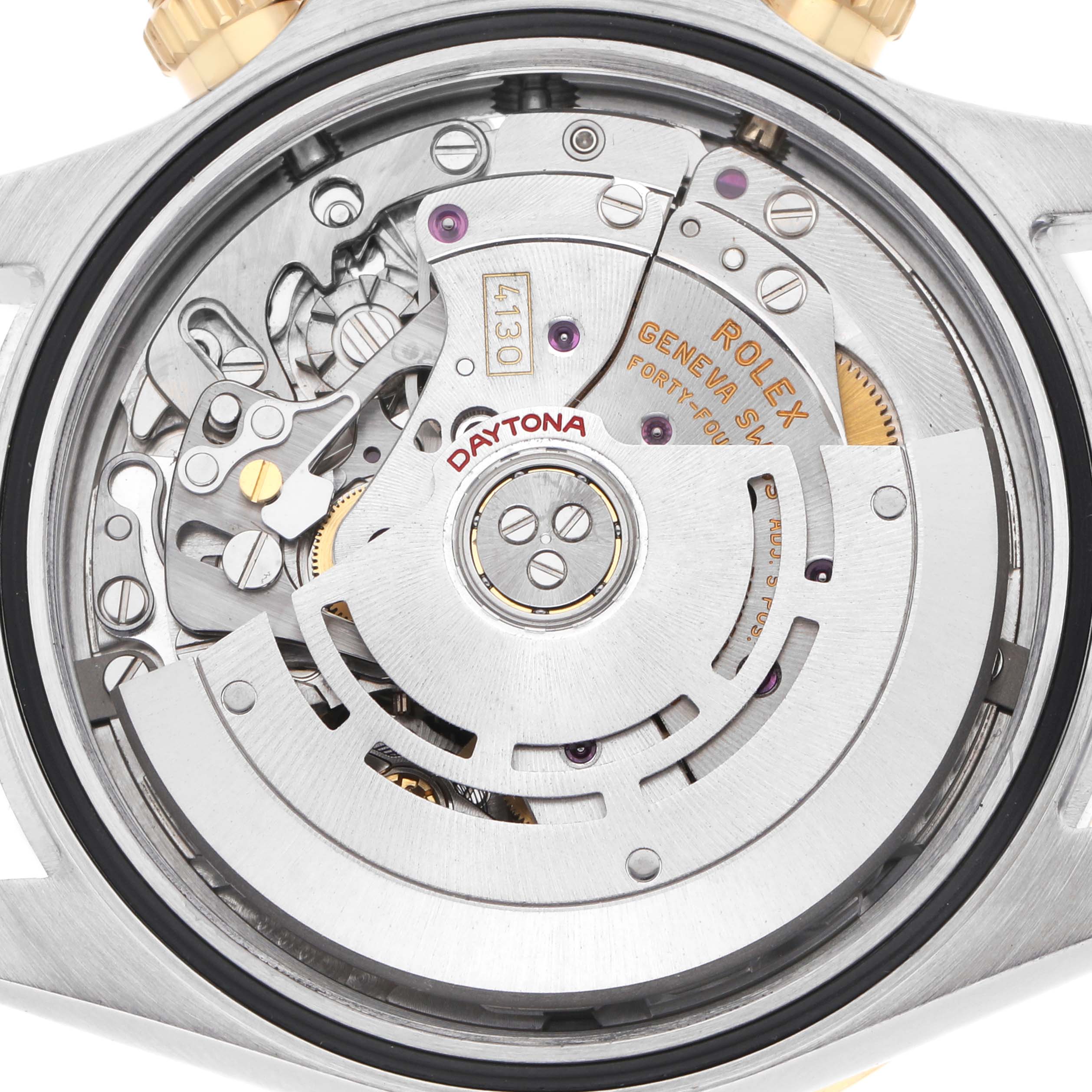 The image shows a close-up view of the movement of a Rolex Daytona 116523 Men
s Steel and Gold (two tone) White Dial watch from the back, highlighting its intricate mechanics.