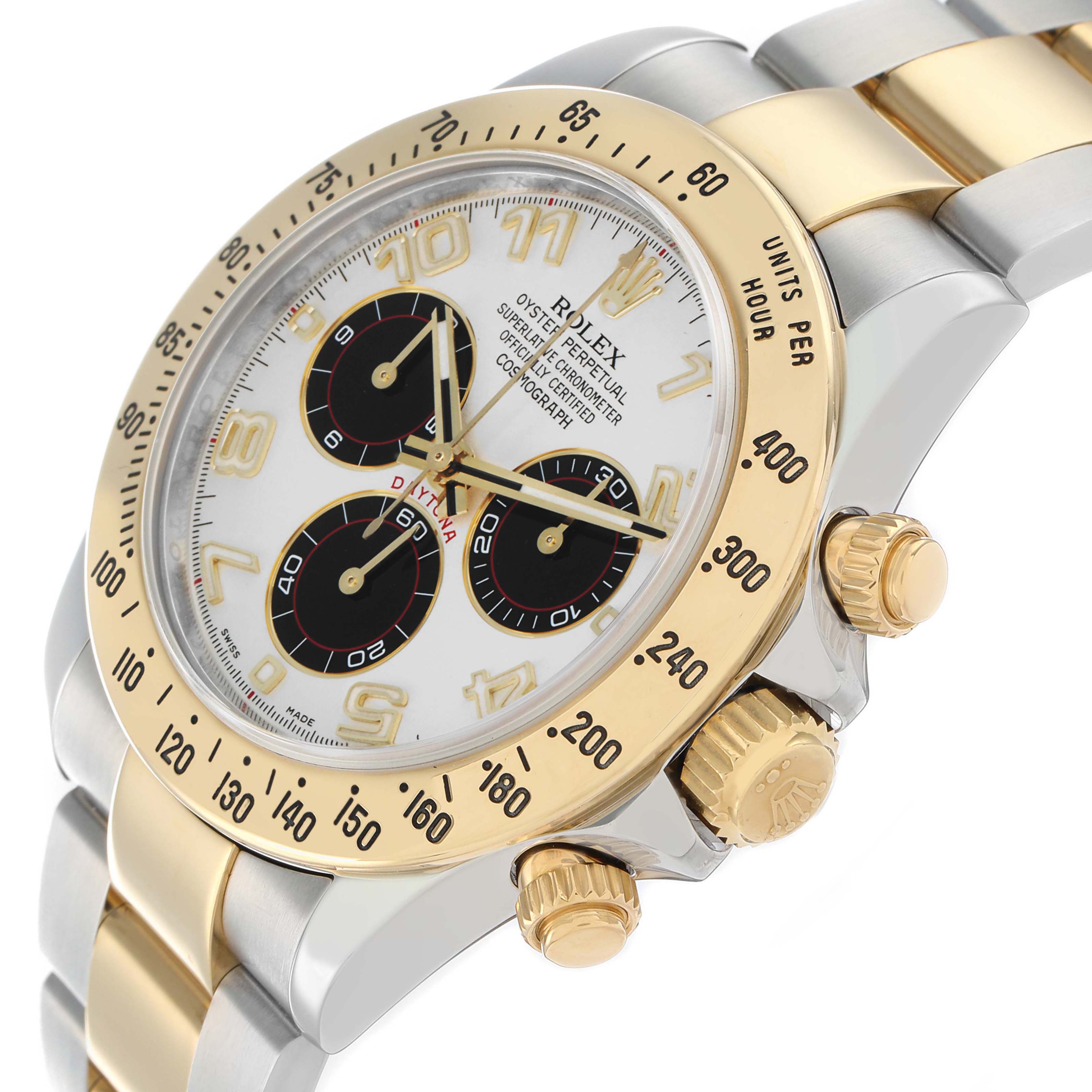 The Rolex Daytona 116523 Men
s Steel and Gold (two tone) White Dial watch is shown from a side angle, highlighting the bezel, crown, pushers, and part of the bracelet.