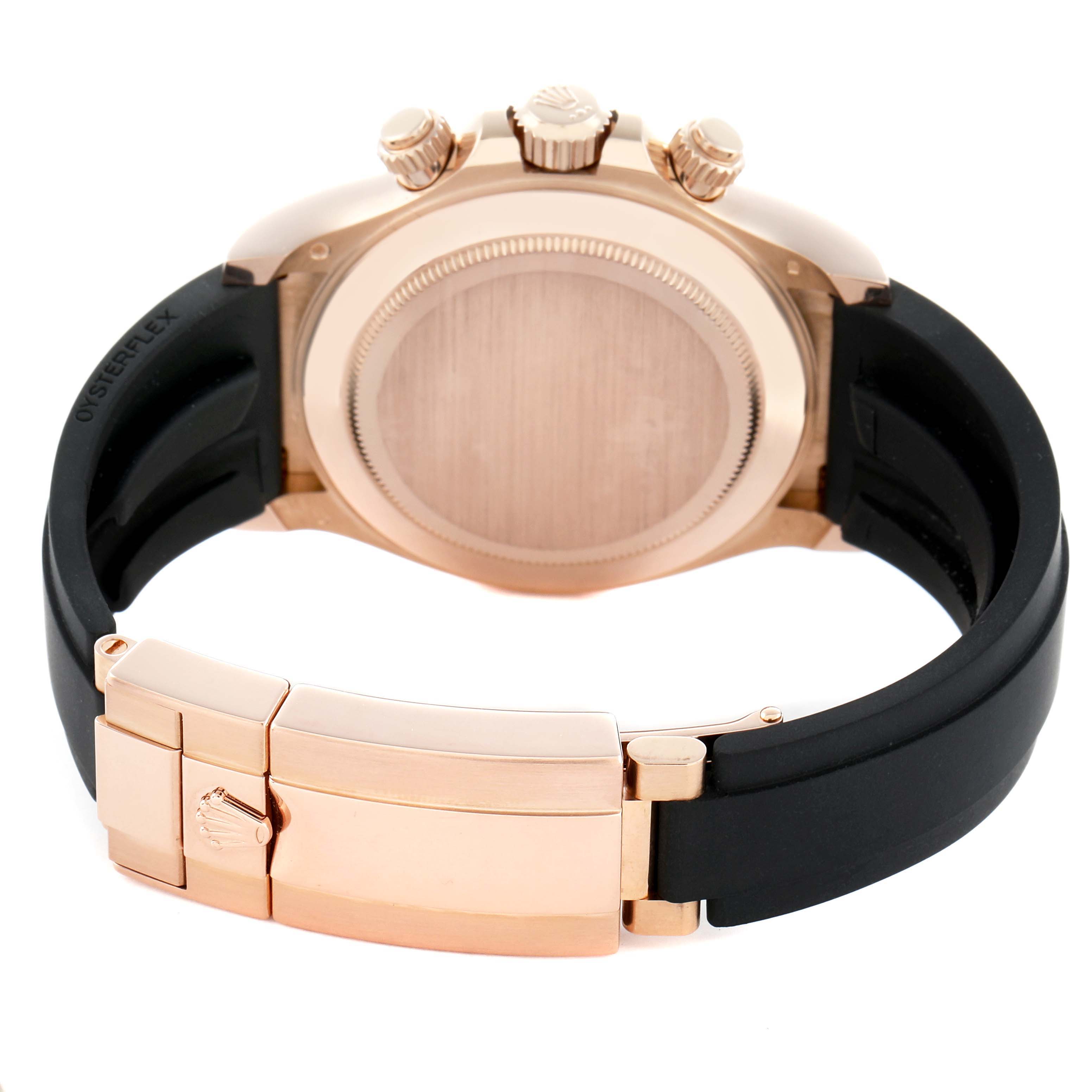 The image shows the back of a Rolex Daytona 116515 Men
s Rose Gold Black Dial watch, focusing on the case, clasp, and Oysterflex strap.