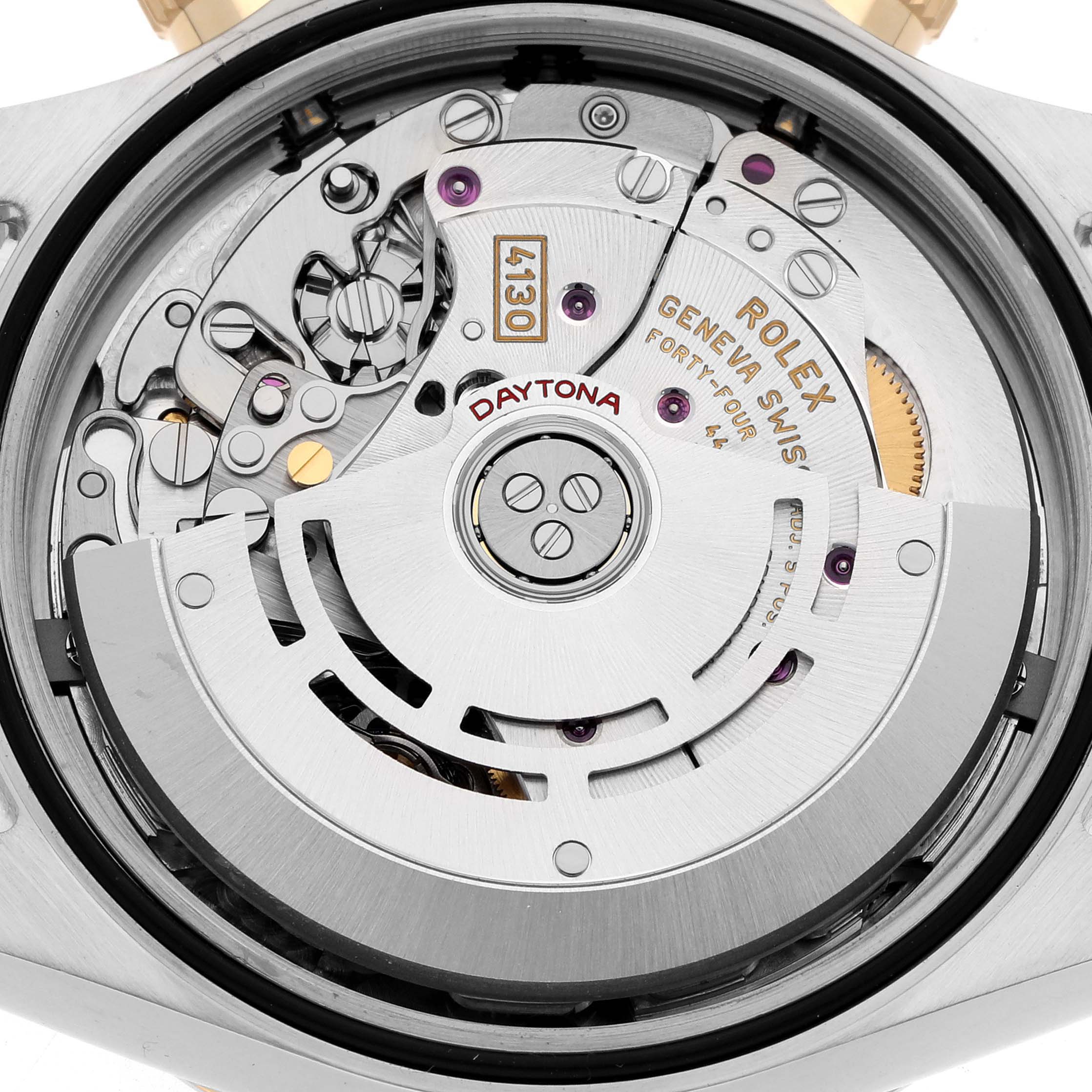 The image shows the Rolex Daytona 116523 Men
s Steel and Gold (two tone) Mother of Pearl Dial
s movement from the back, highlighting gears, rotor, and intricate components.