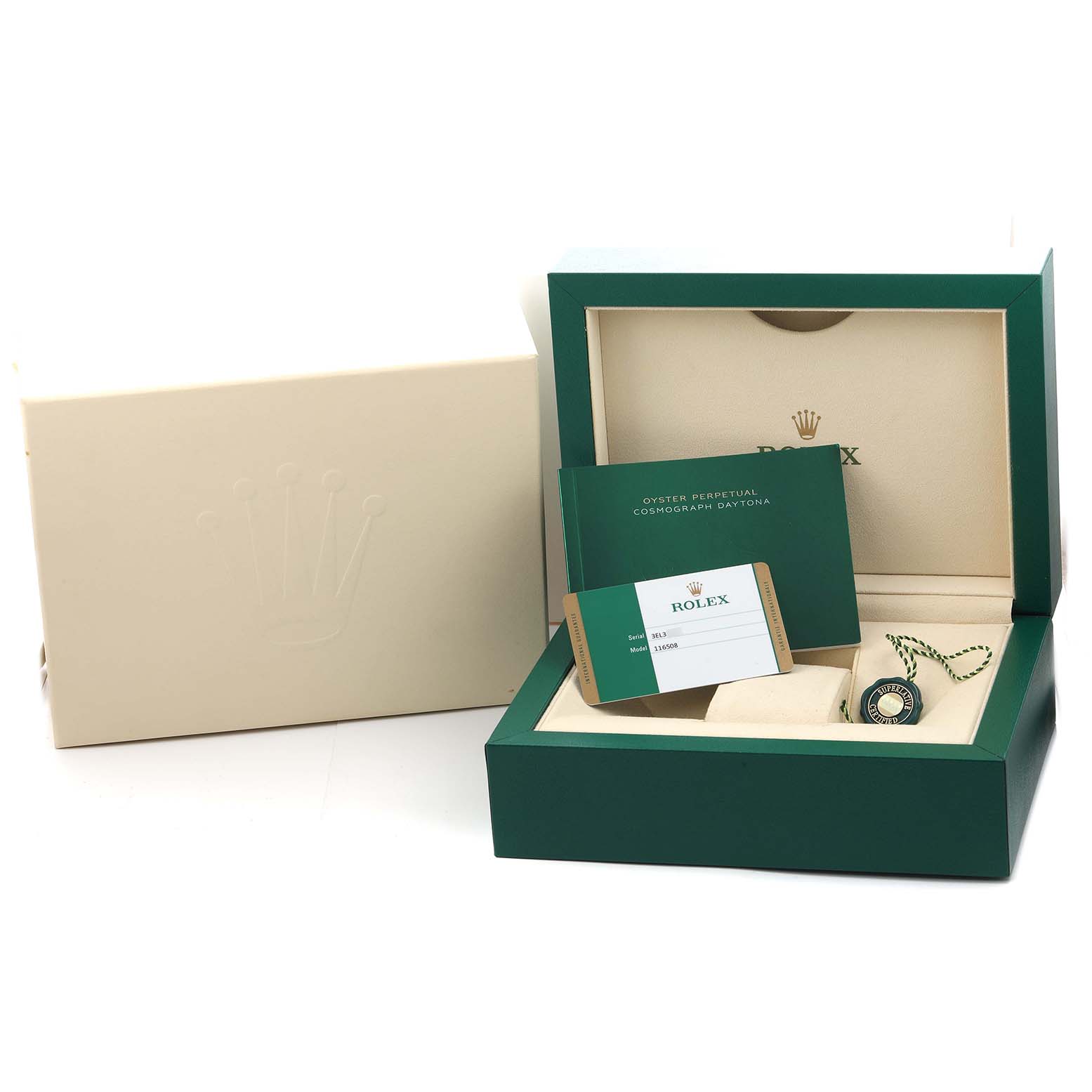 The image shows the packaging and accessories for a Rolex Daytona 116508 Men
s Yellow Gold Green Dial model, including the box, booklets, and tags, viewed at an angle.