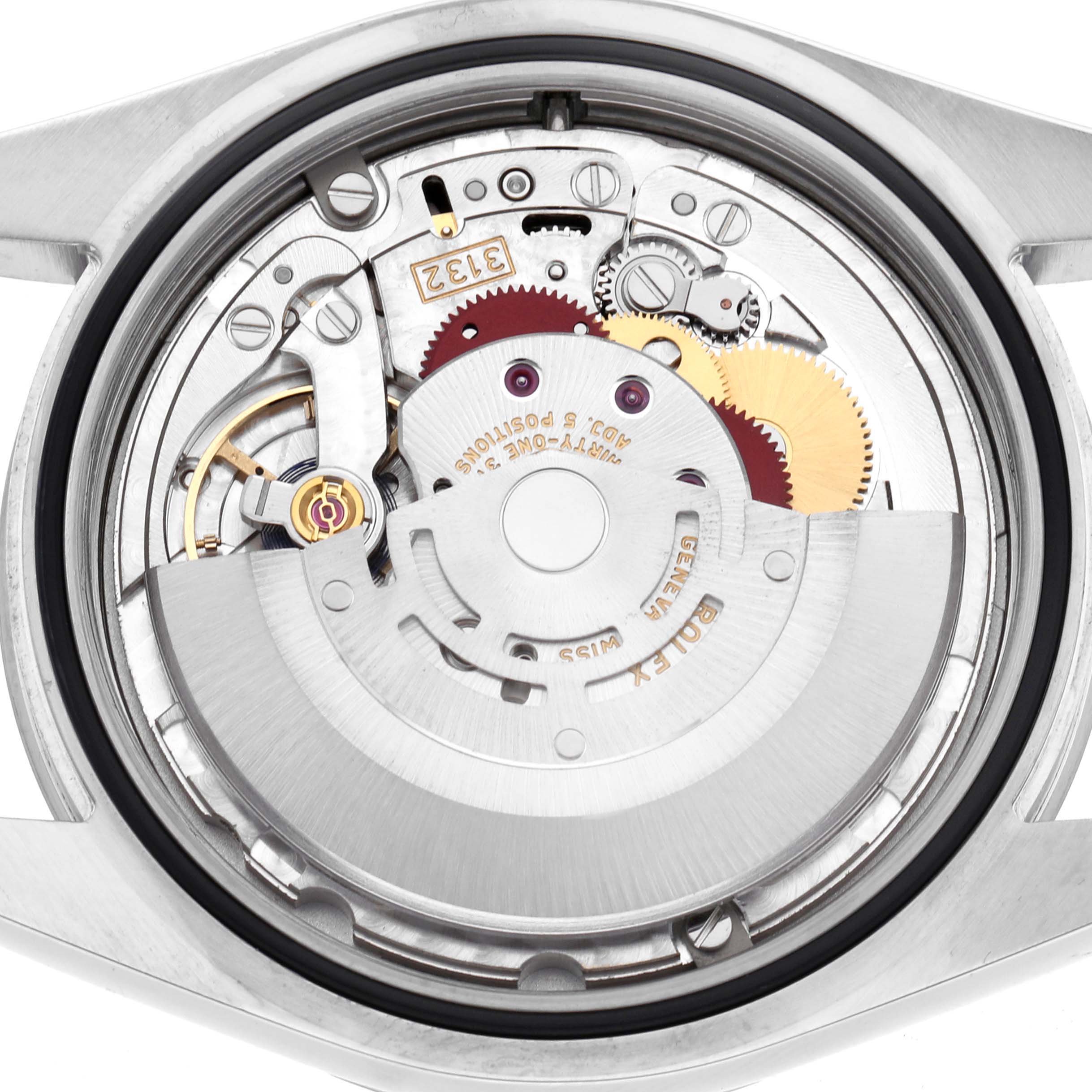 The image shows the backside and internal mechanism of a Rolex Explorer 214270 Men
s Stainless Steel Black Dial watch, highlighting the movement components.